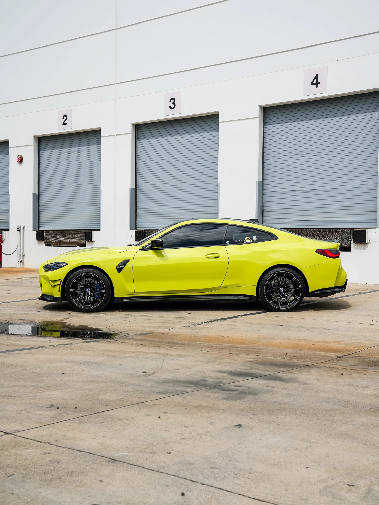 BMW M4 after Paint Protection Film (PPF), left-side profile