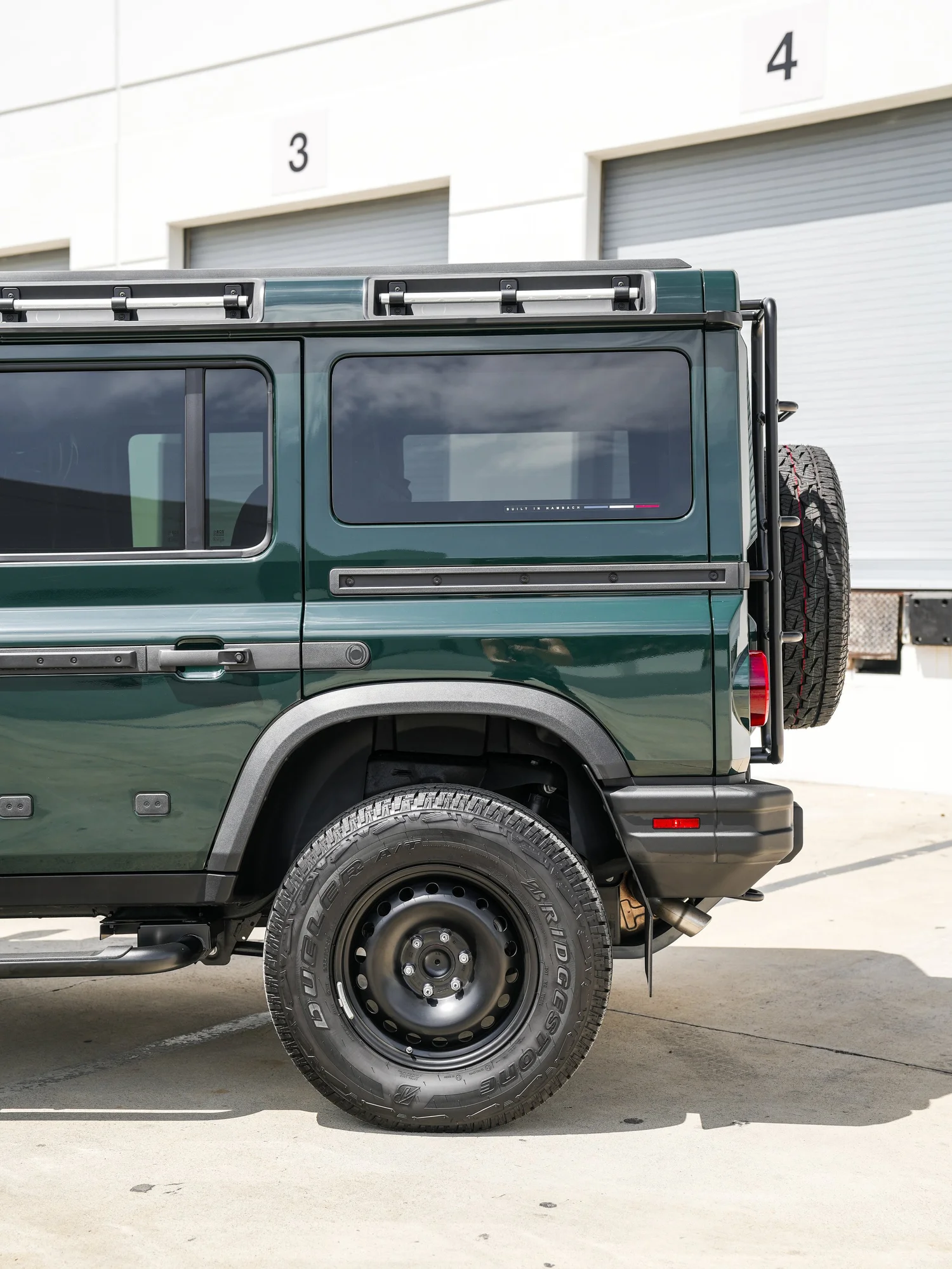 INEOS Grenadier after Window Tint, rear-right three-quarter view