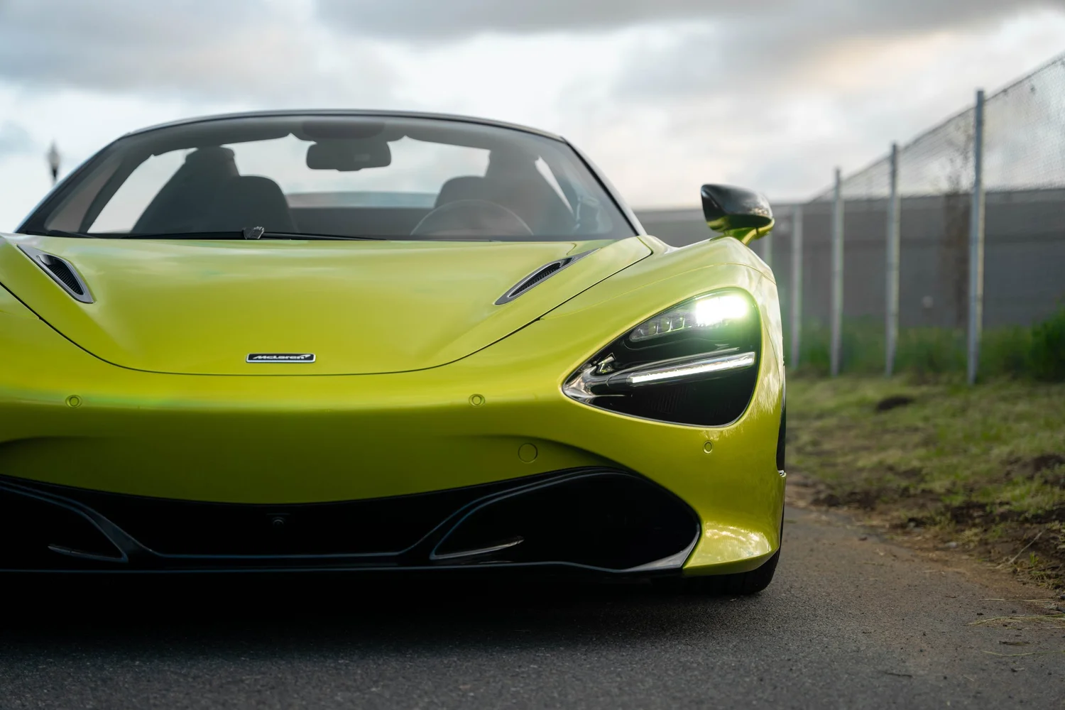 Green McLaren 720S after Paint Protection Film (PPF), Window Tint and Ceramic Coating, front wheel and body view