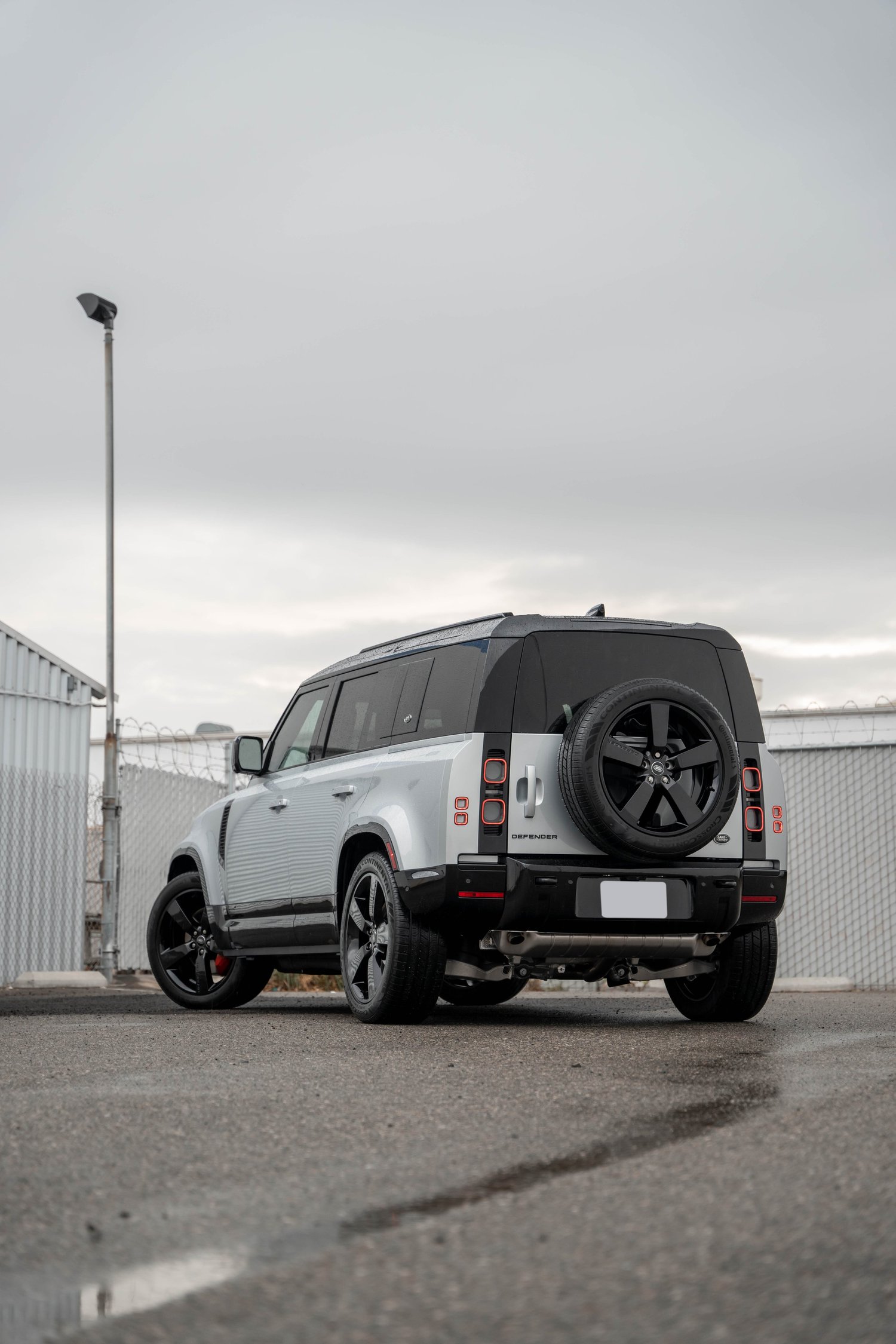 Land Rover Defender after Paint Protection Film (PPF), Window Tint and Ceramic Coating, wide rear three-quarter view