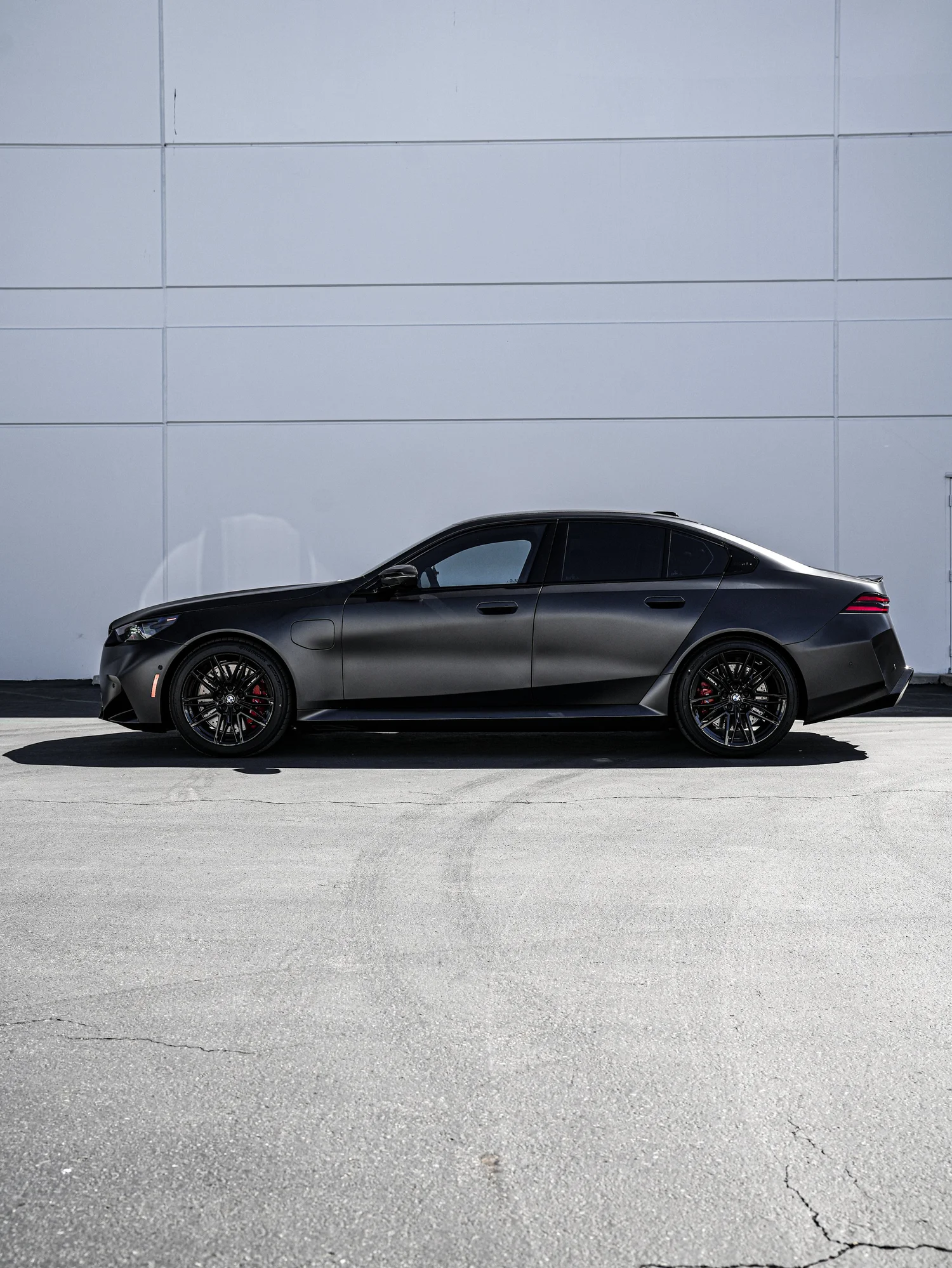 BMW G90 M5 after Matte PPF, Window Tint and Ceramic Coating, left-side profile