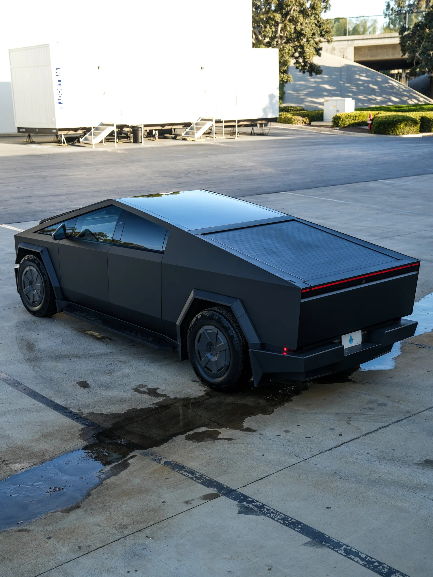 Tesla Cybertruck wide rear three-quarter finished view after PROTEK matte black PPF and window tint