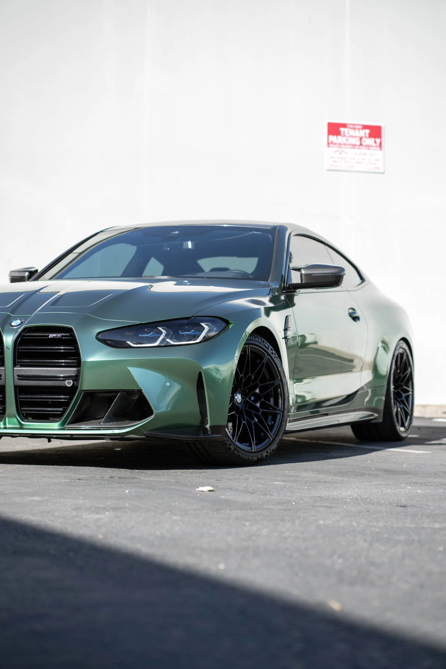 BMW M4 Racing Green after Vinyl Wrap, front-right three-quarter view