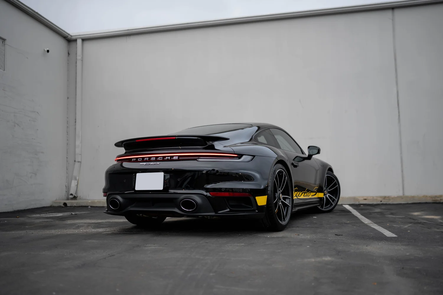 Rear three-quarter view of the black Porsche Turbo S