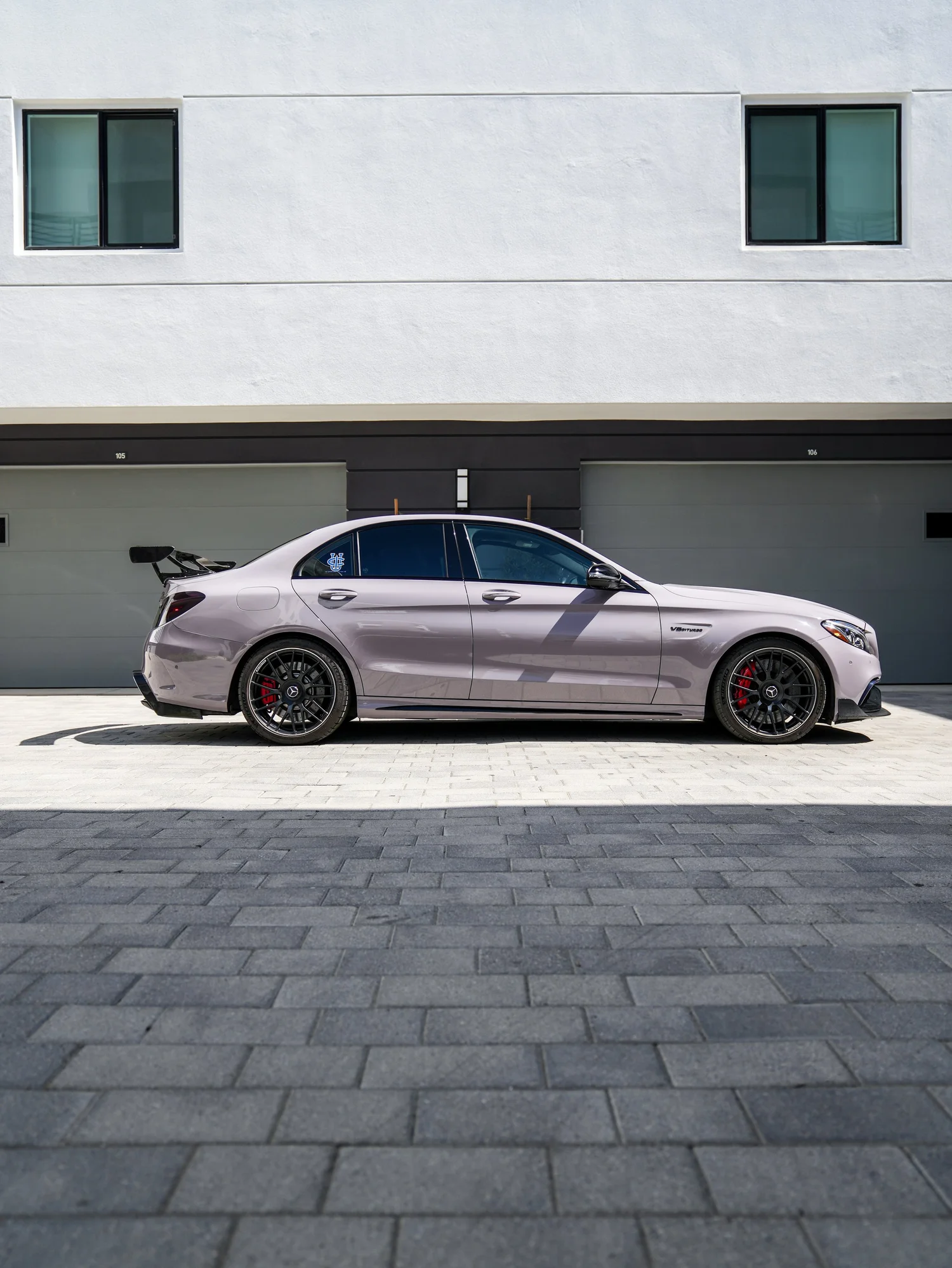 Mercedes-AMG C 63 S Inozetek Pigeon Grey after Vinyl Wrap, rear-left three-quarter view