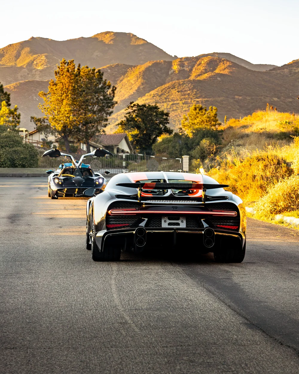 Pagani Huayra leading Bugatti Chiron Super Sport 300+ on a mountain road