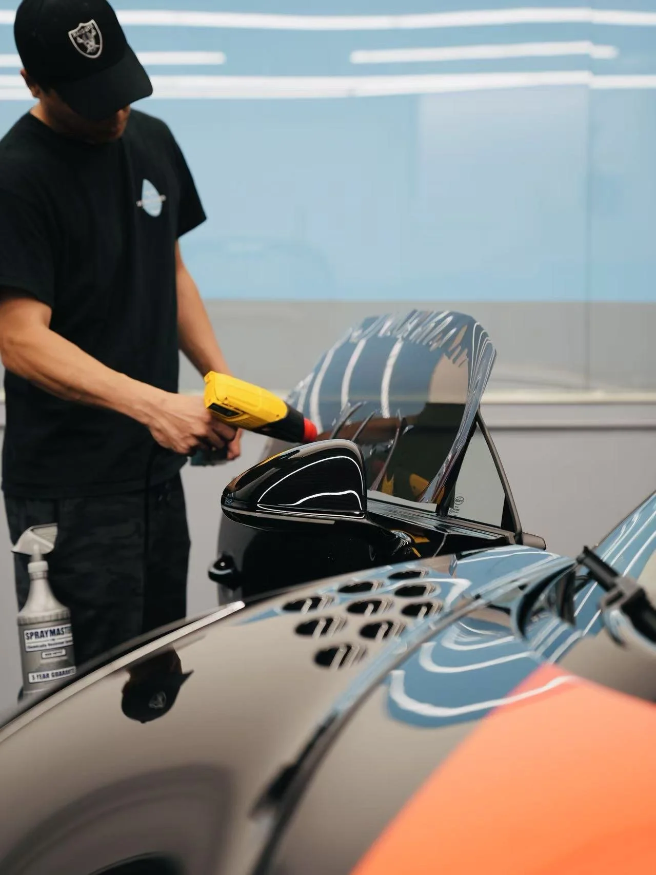 Bugatti window tint project inside Toyz Detail Studio.