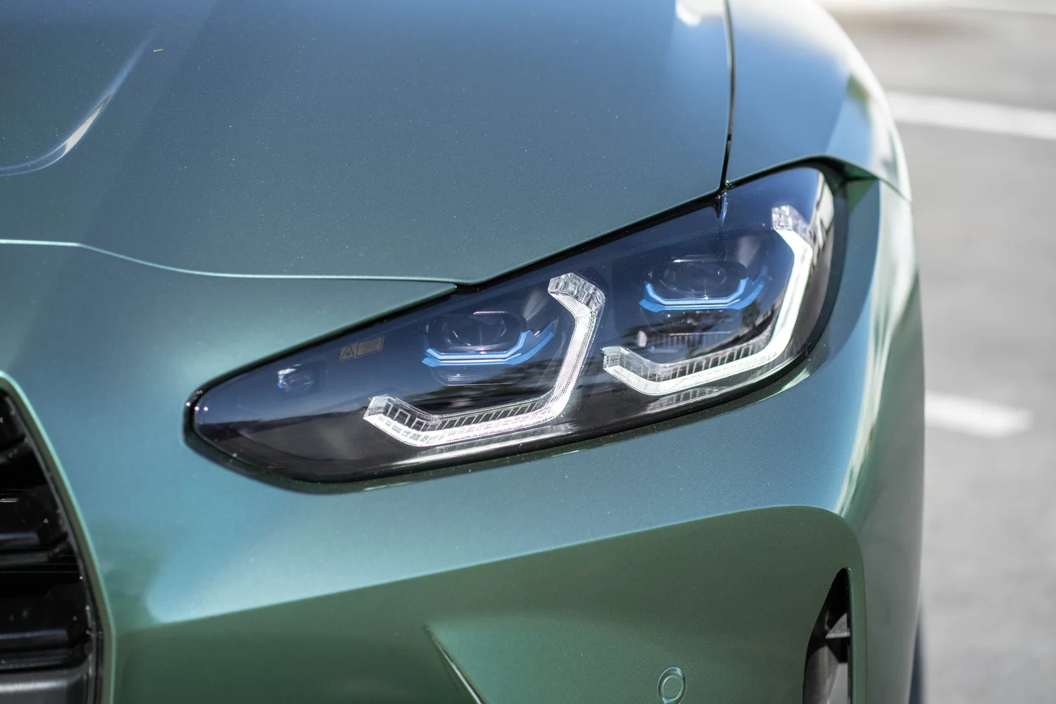 BMW M4 Racing Green after Vinyl Wrap, front-corner view