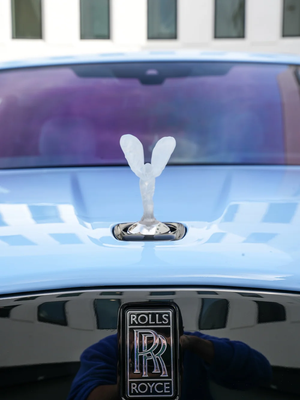 Crystal Spirit of Ecstasy above the Rolls-Royce grille badge with the Cullinan windshield behind it