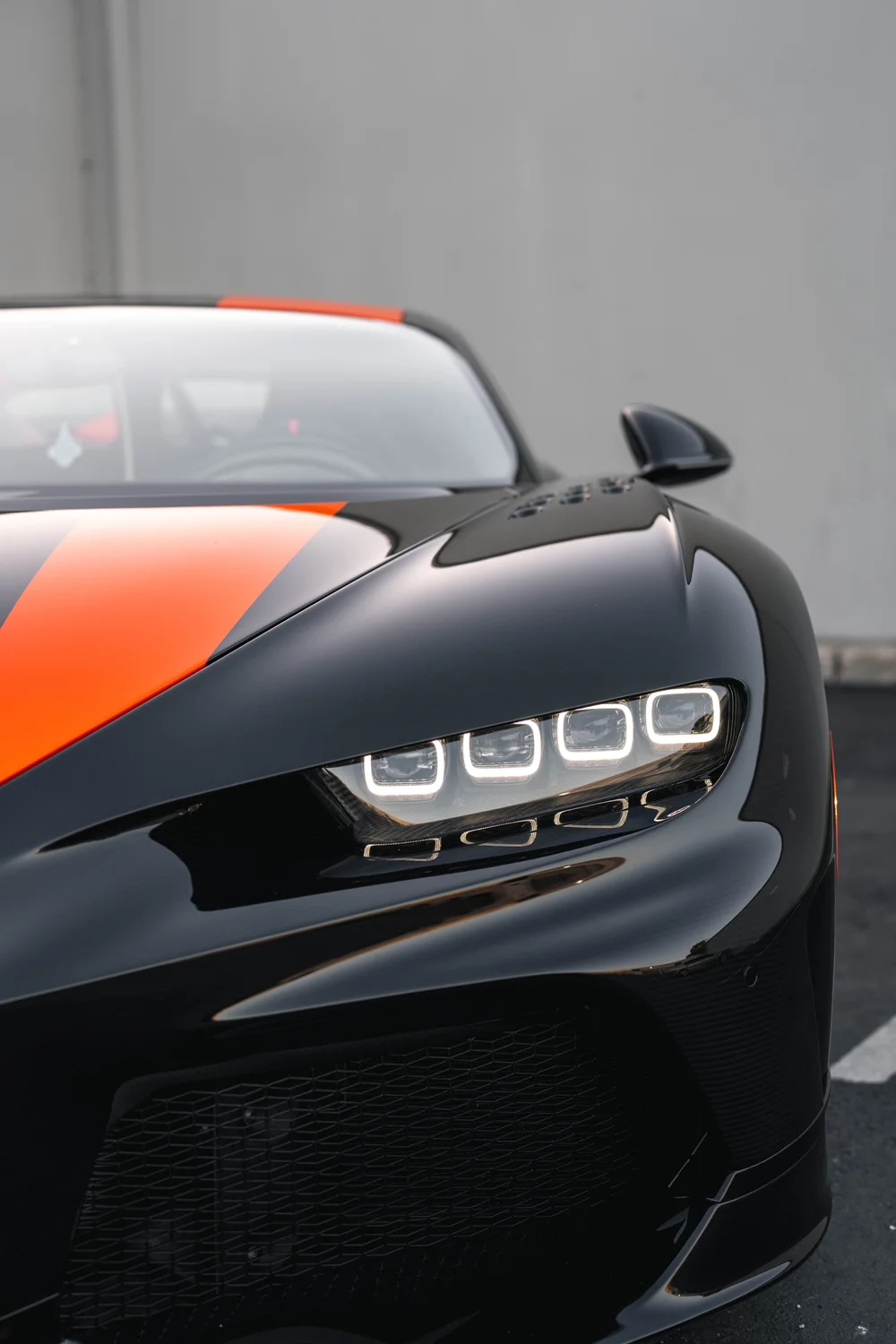 Bugatti Chiron Super Sport 300+ headlight and front bumper in a portrait close view