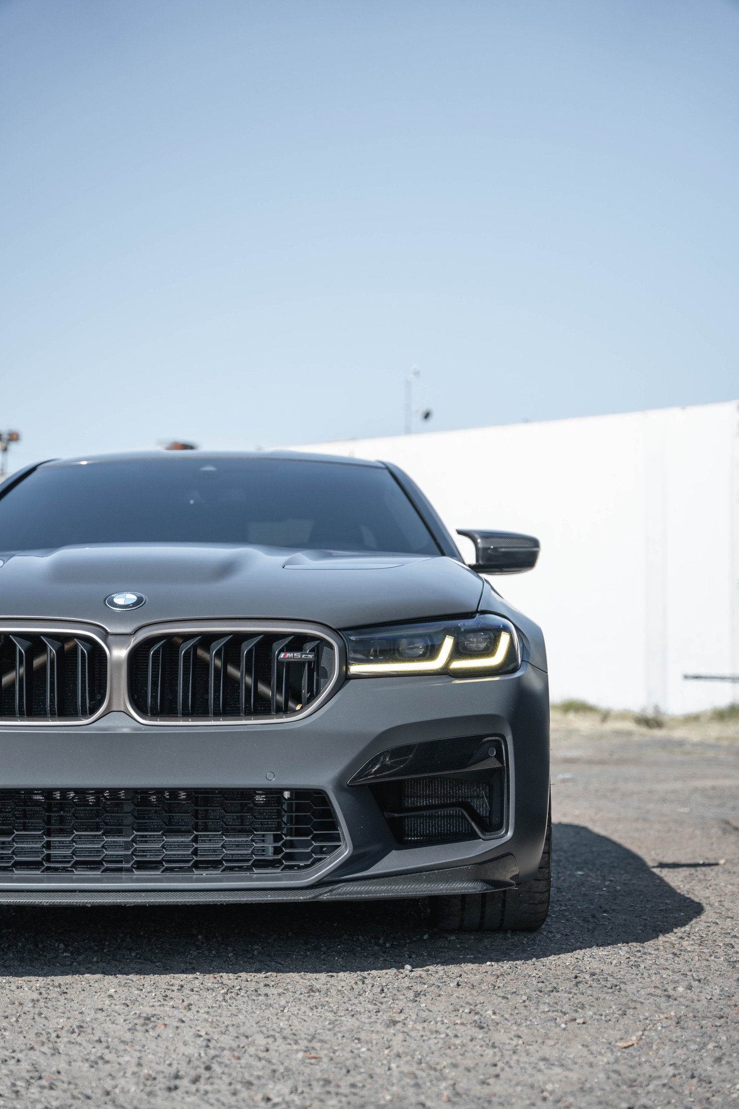 BMW M5 CS after Matte PPF, Window Tint and Ceramic Coating, low-angle front view