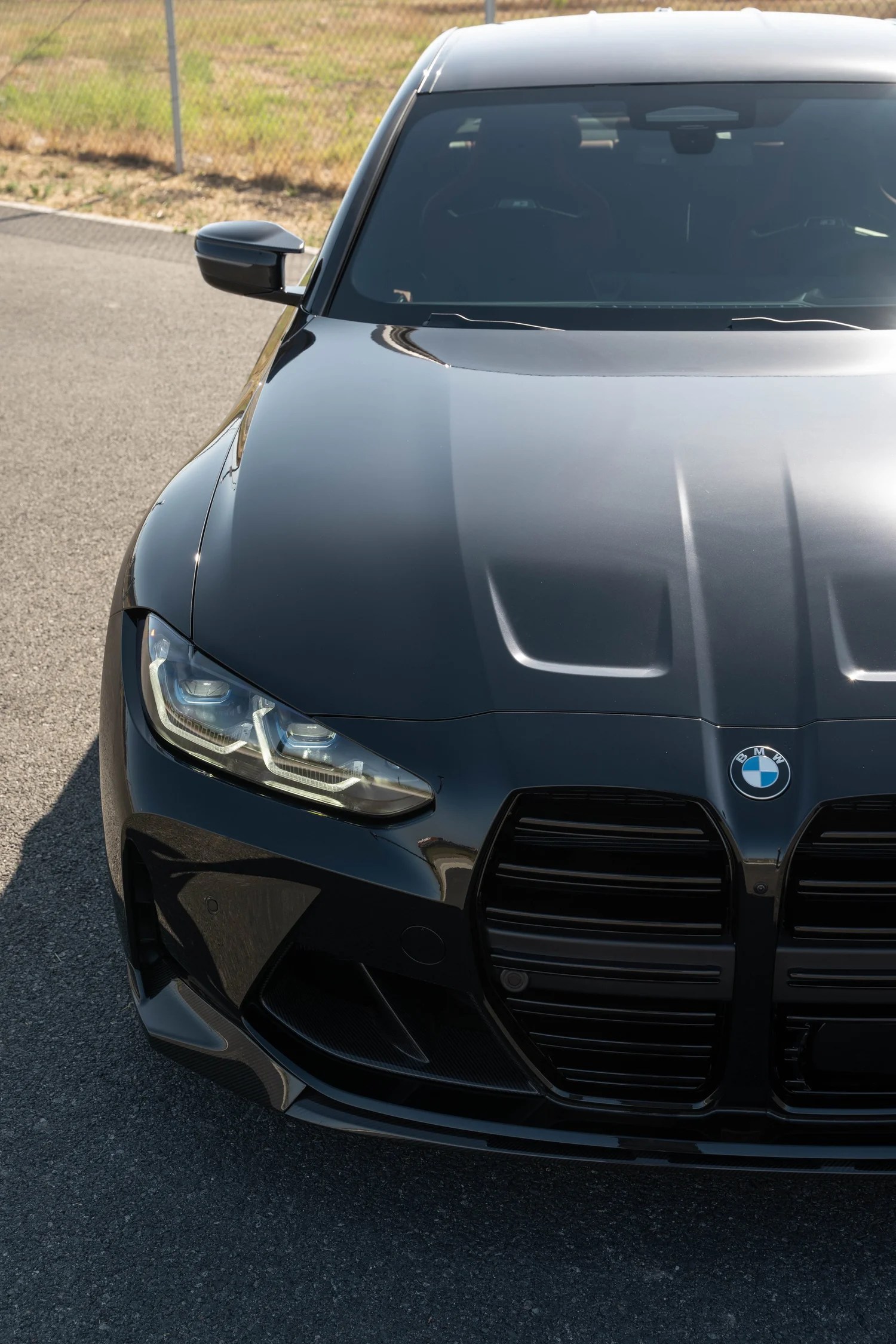 Black BMW M3 after Paint Protection Film (PPF), Window Tint and Ceramic Coating, front-corner view