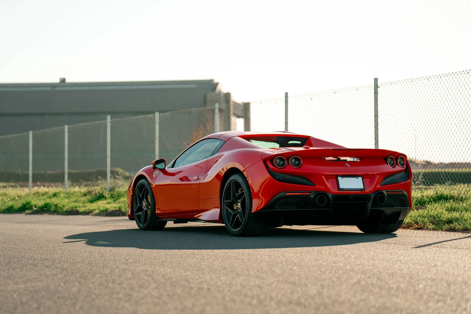 Red Ferrari F8 after Paint Protection Film (PPF), Window Tint and Ceramic Coating, rear-left three-quarter view