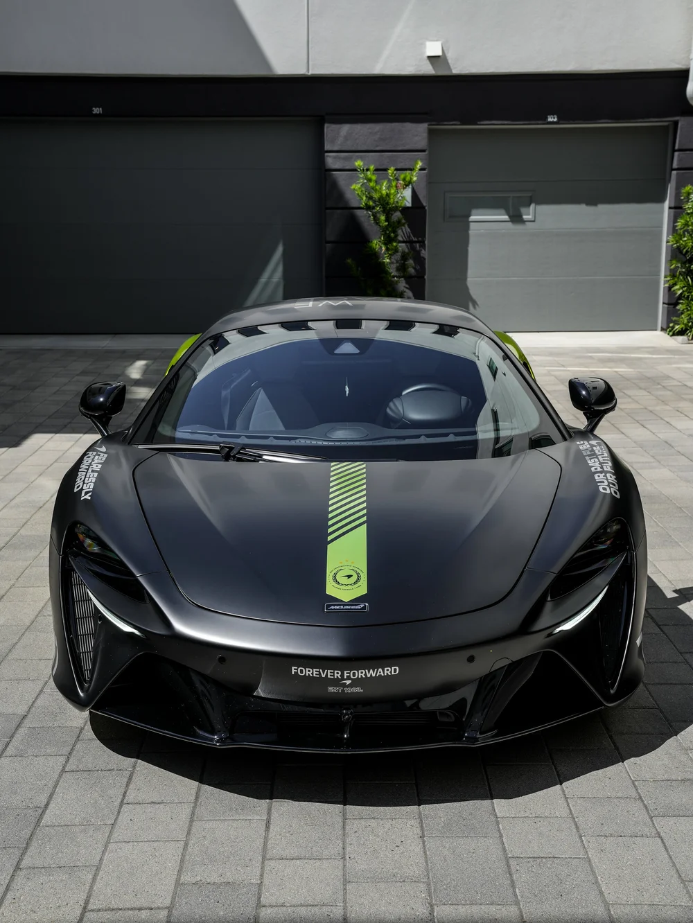 Straight front view of the Artura with the green stripe centered on the hood