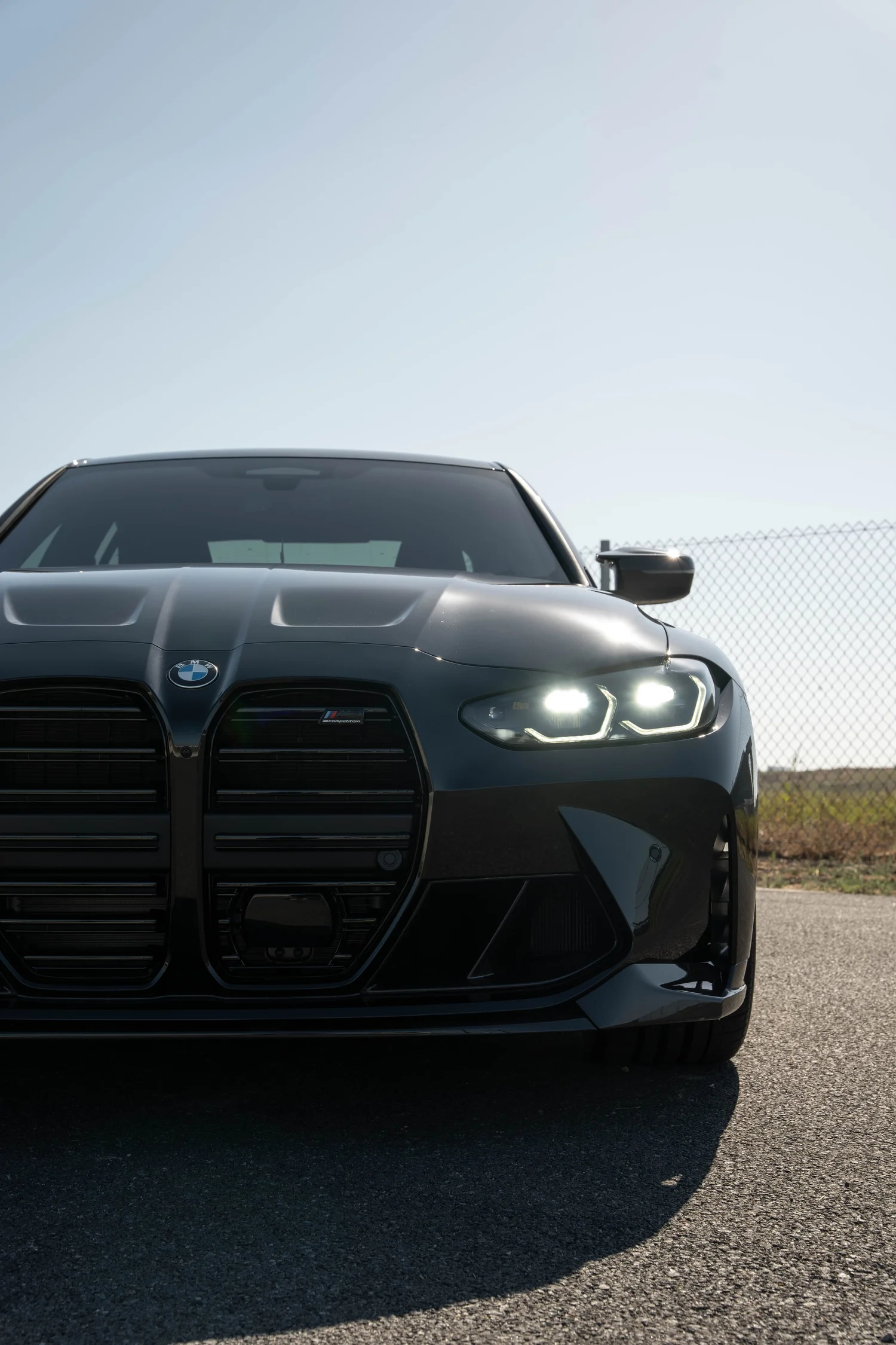 Black BMW M3 after Paint Protection Film (PPF), Window Tint and Ceramic Coating, low-angle front view