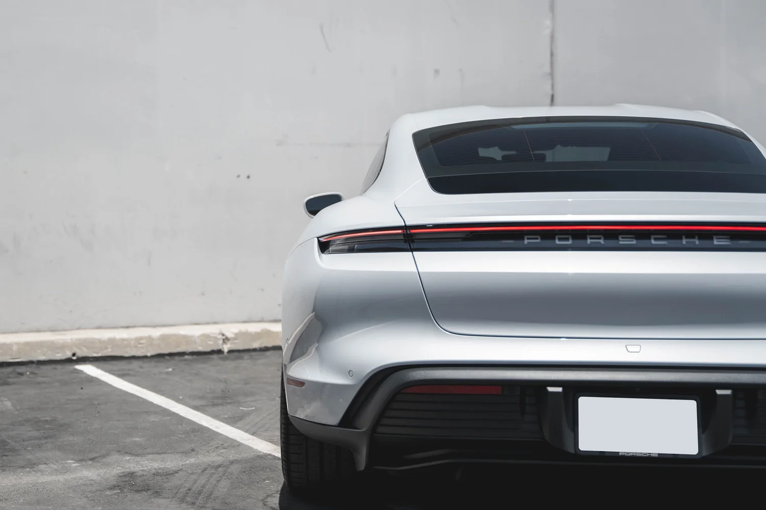 Porsche Taycan after Paint Protection Film (PPF), Window Tint and Ceramic Coating, rear body and taillight view