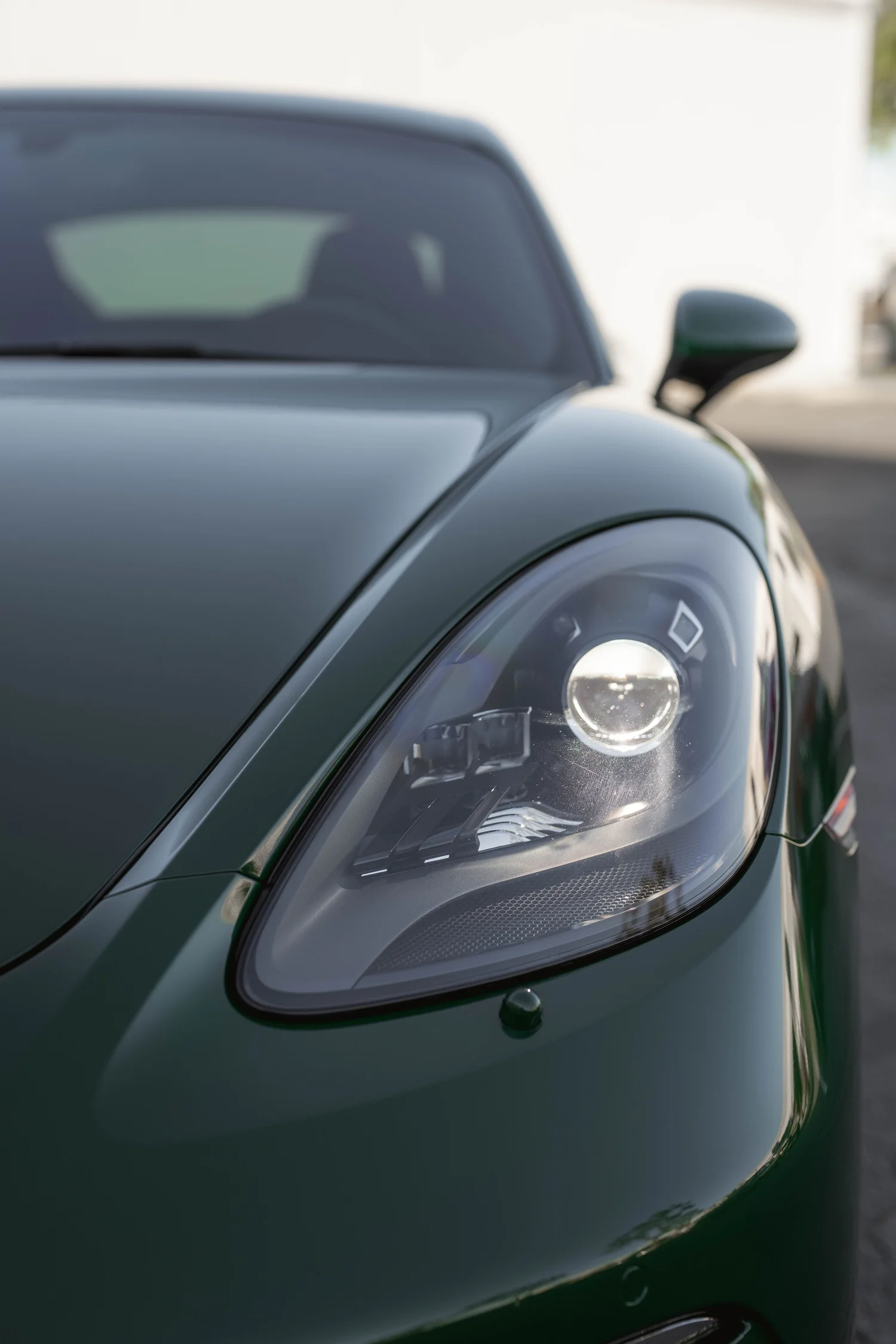 Porsche 718 Cayman S Racing Green after Vinyl Wrap, front-corner view