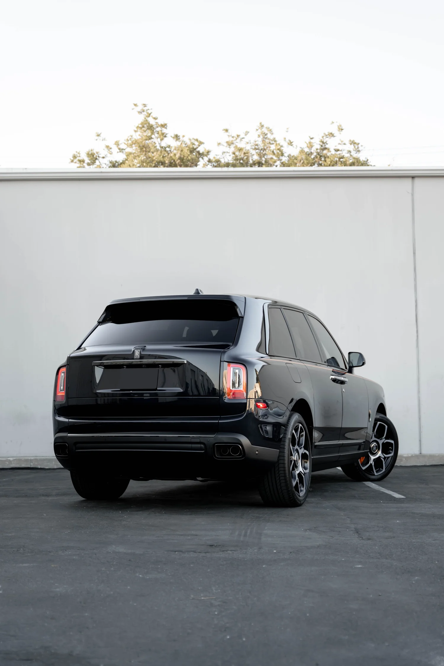 Black Rolls-Royce Cullinan Black Badge after Paint Protection Film (PPF), Window Tint and Ceramic Coating, rear-left three-quarter view