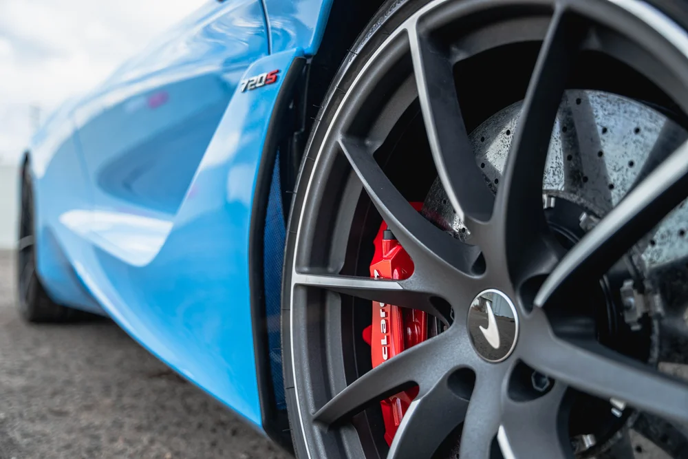 McLaren 720S wheel and red brake caliper detail