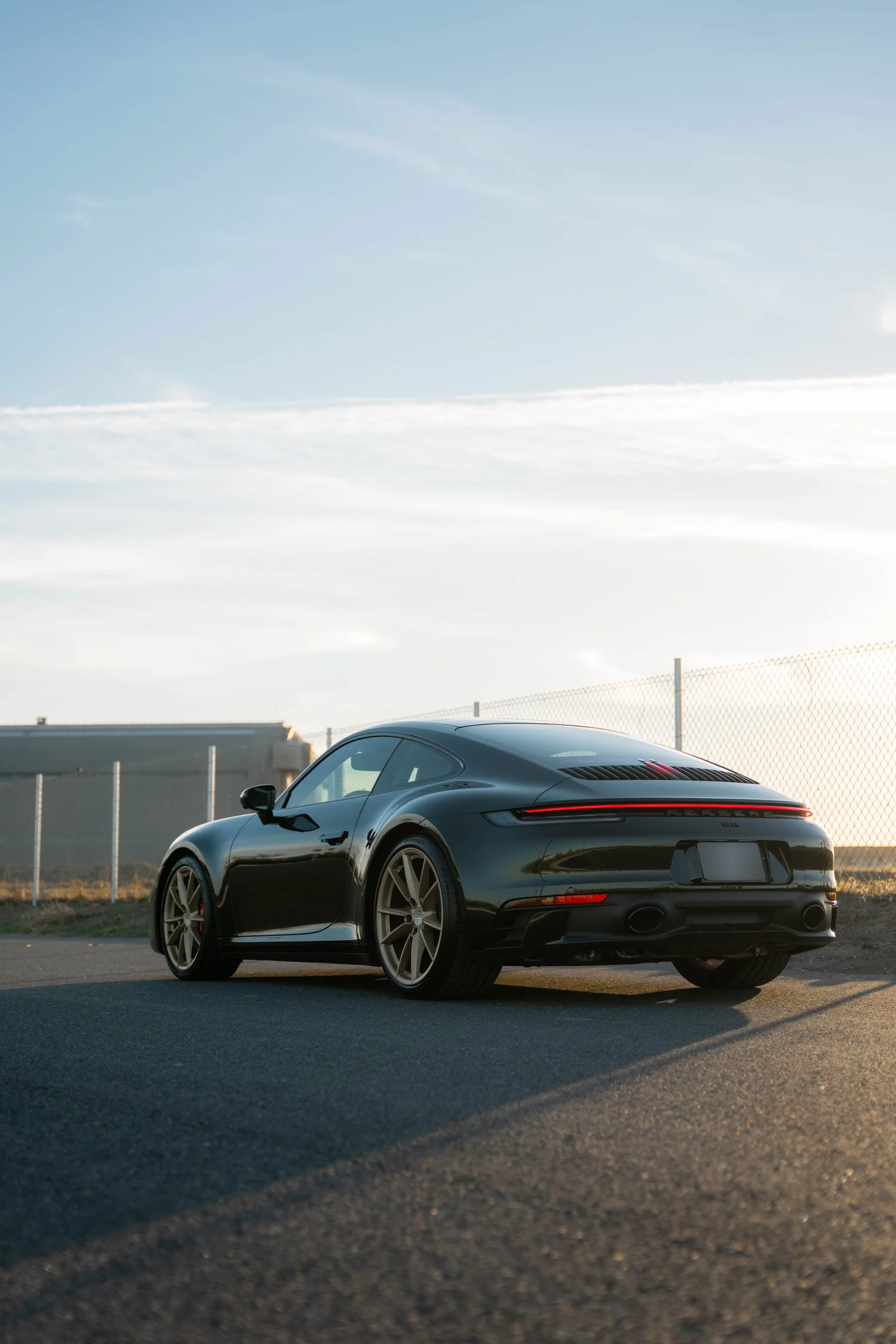 Porsche 911 Carrera Wrapped in British Green after Vinyl Wrap, wide outdoor view