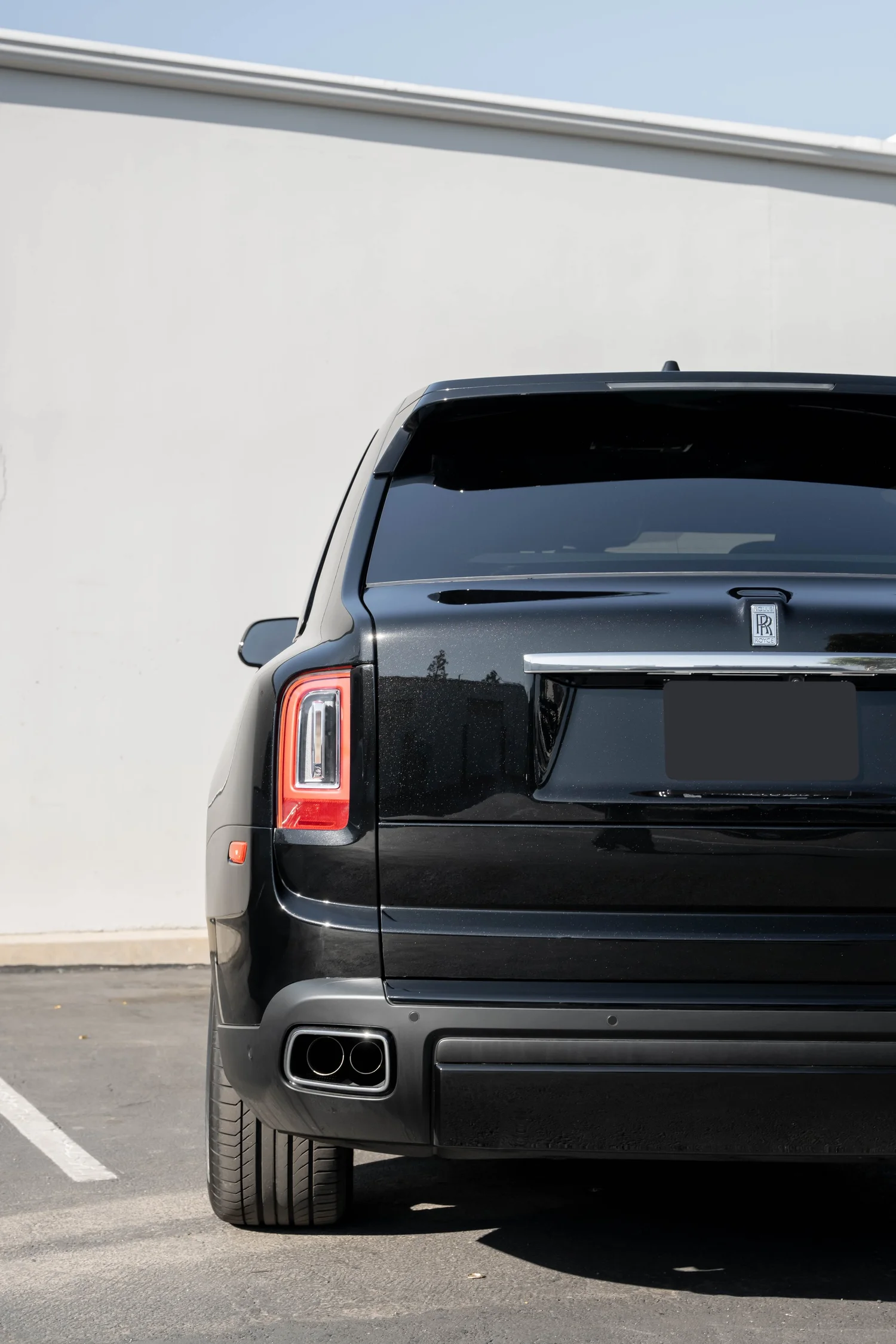 Dark Metallic Grey Rolls-Royce Cullinan after Paint Protection Film (PPF), Window Tint and Ceramic Coating, direct rear view