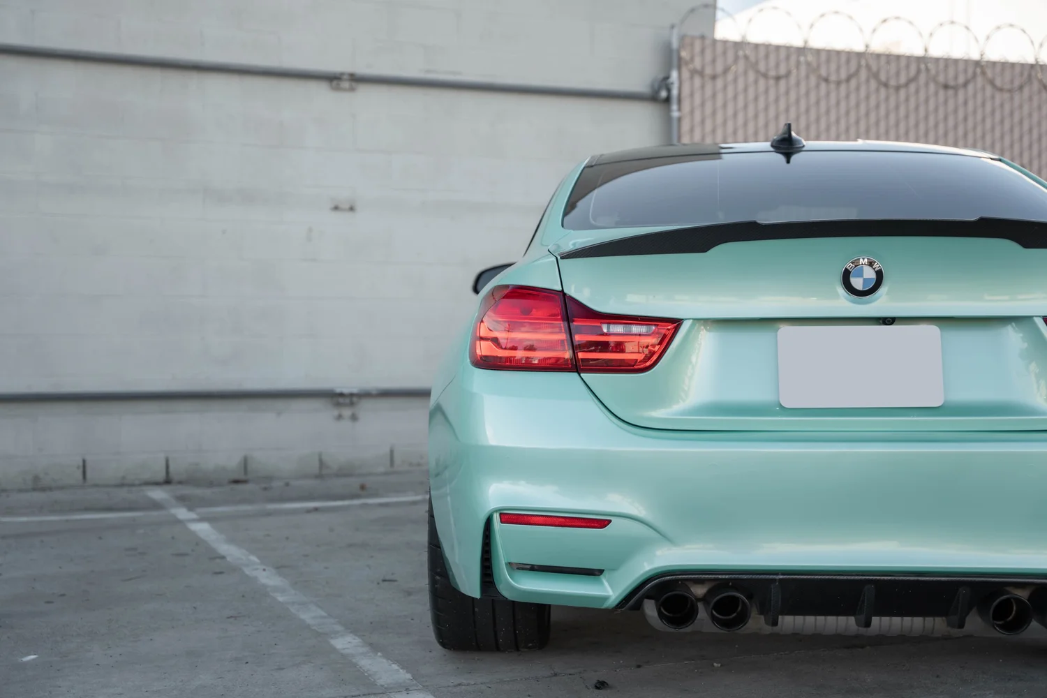 BMW M4 Mint Green after Vinyl Wrap, rear diffuser and exhaust detail
