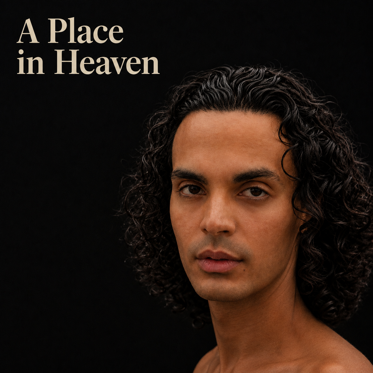 Close-up of a Marcelo Kuna, a person with dark, curly hair and tan skin, looking directly at the camera, with the text 'A Place in Heaven' in the upper left corner.