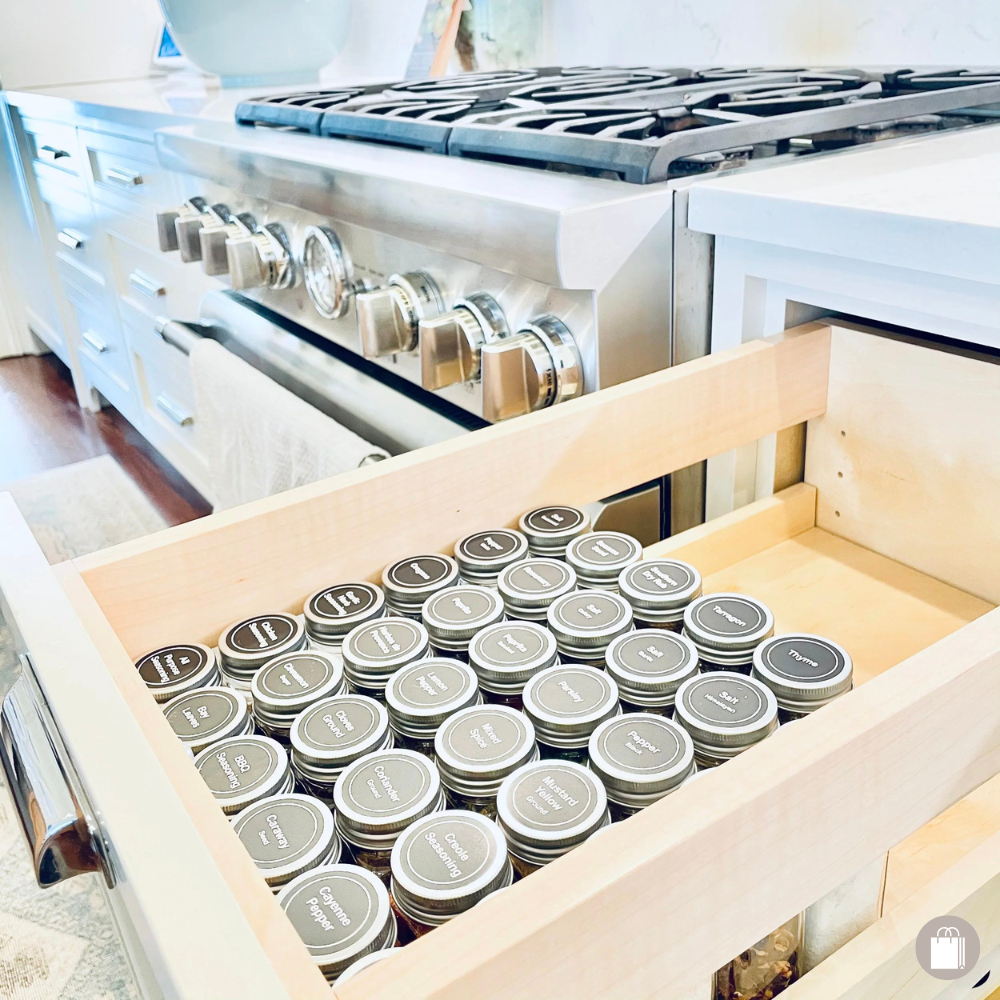 Expertly organized kitchen spice drawer next to stovetop edited by Sorted Professional Organizing in New Orleans.
