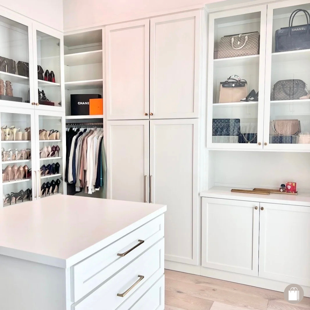 Upscale closet with glass-door cabinets displaying high-heeled shoes and handbags, decluttered and organized by Sorted Professional Organizing in New Orleans.
