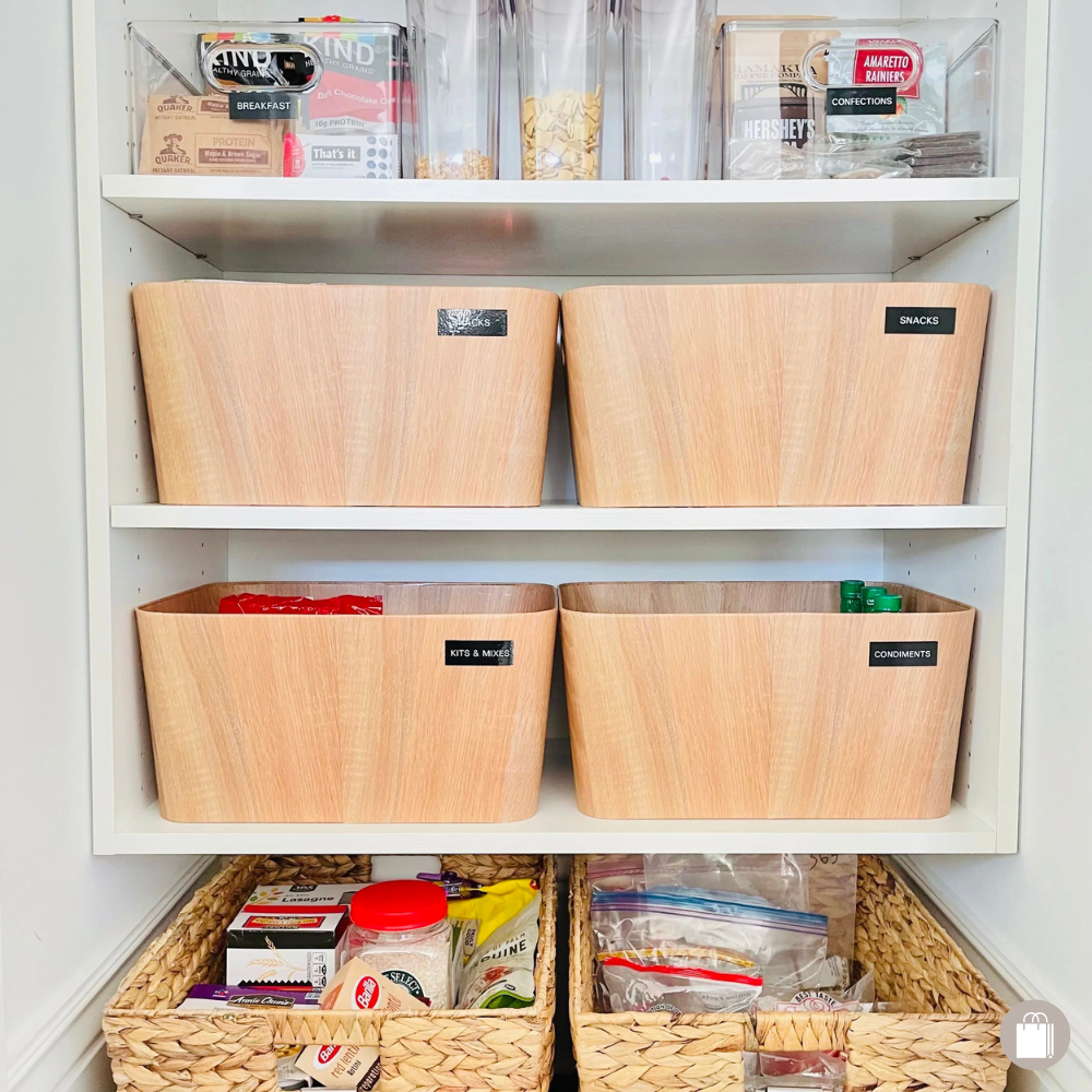 An accessible pantry with seagrass baskets, bamboo and acrylic labeled bins decluttered by Sorted Professional Organizing in New Orleans.