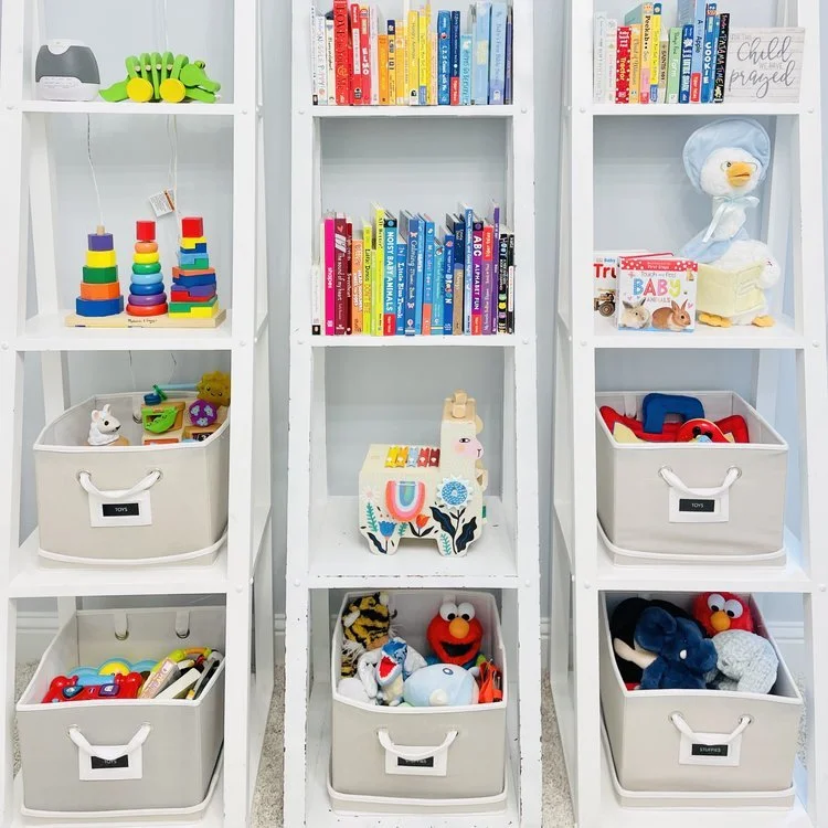 Colorful toys and books neatly organized into fabric bins and shelves by Sorted Professional Organizing in New Orleans.