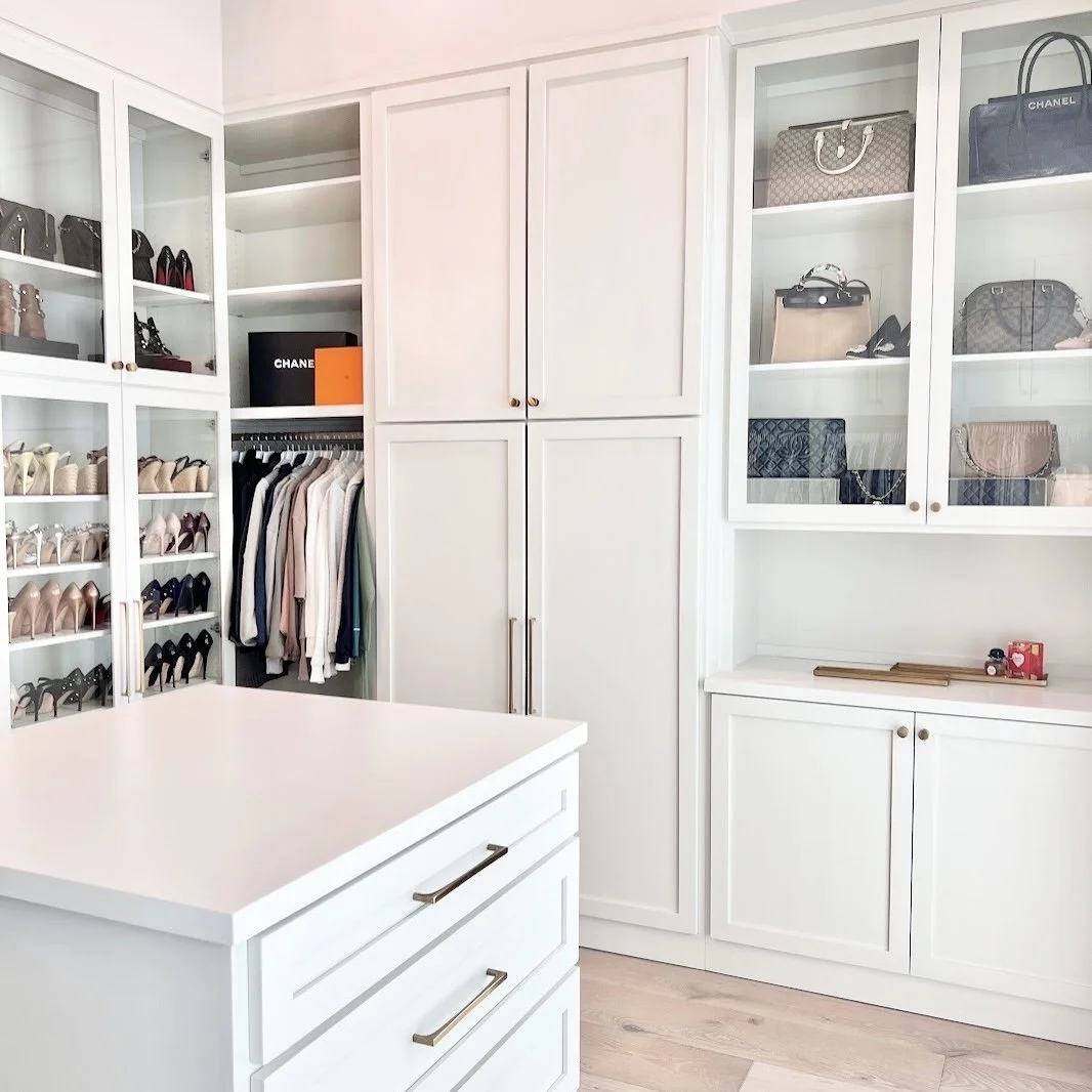 Upscale closet with glass-door cabinets displaying high-heeled shoes and handbags, decluttered and organized by Sorted Professional Organizing in New Orleans.