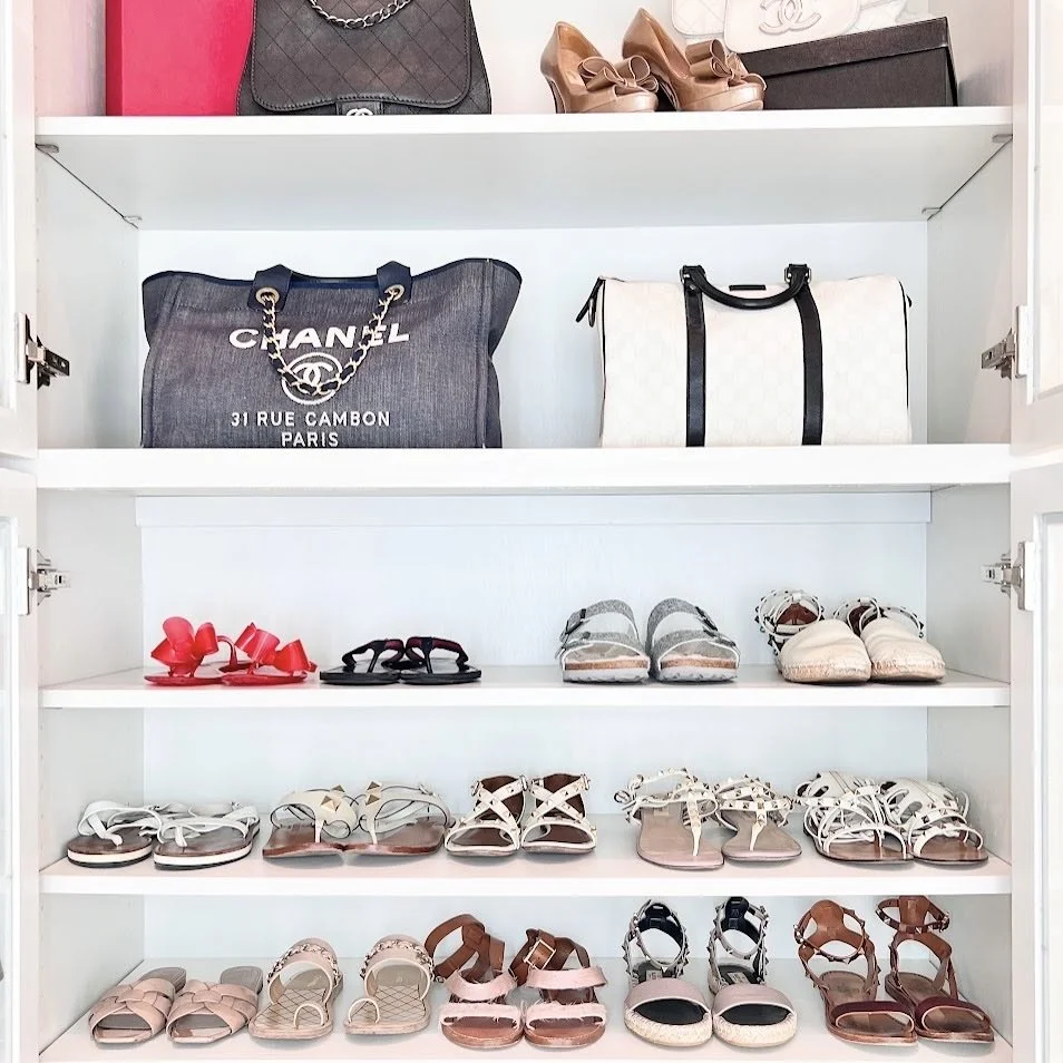 Closet cabinet shelves neatly holding sandals and Chanel bags, organized by Sorted Professional Organizing in New Orleans.