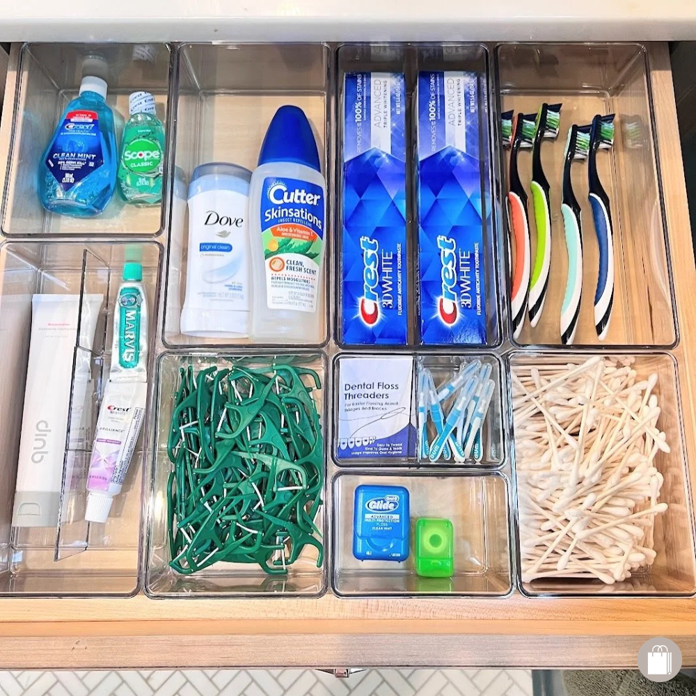 Bathroom drawer neatly organized with The Home Edit acrylic bins for functional storage by Sorted Professional Organizing.
