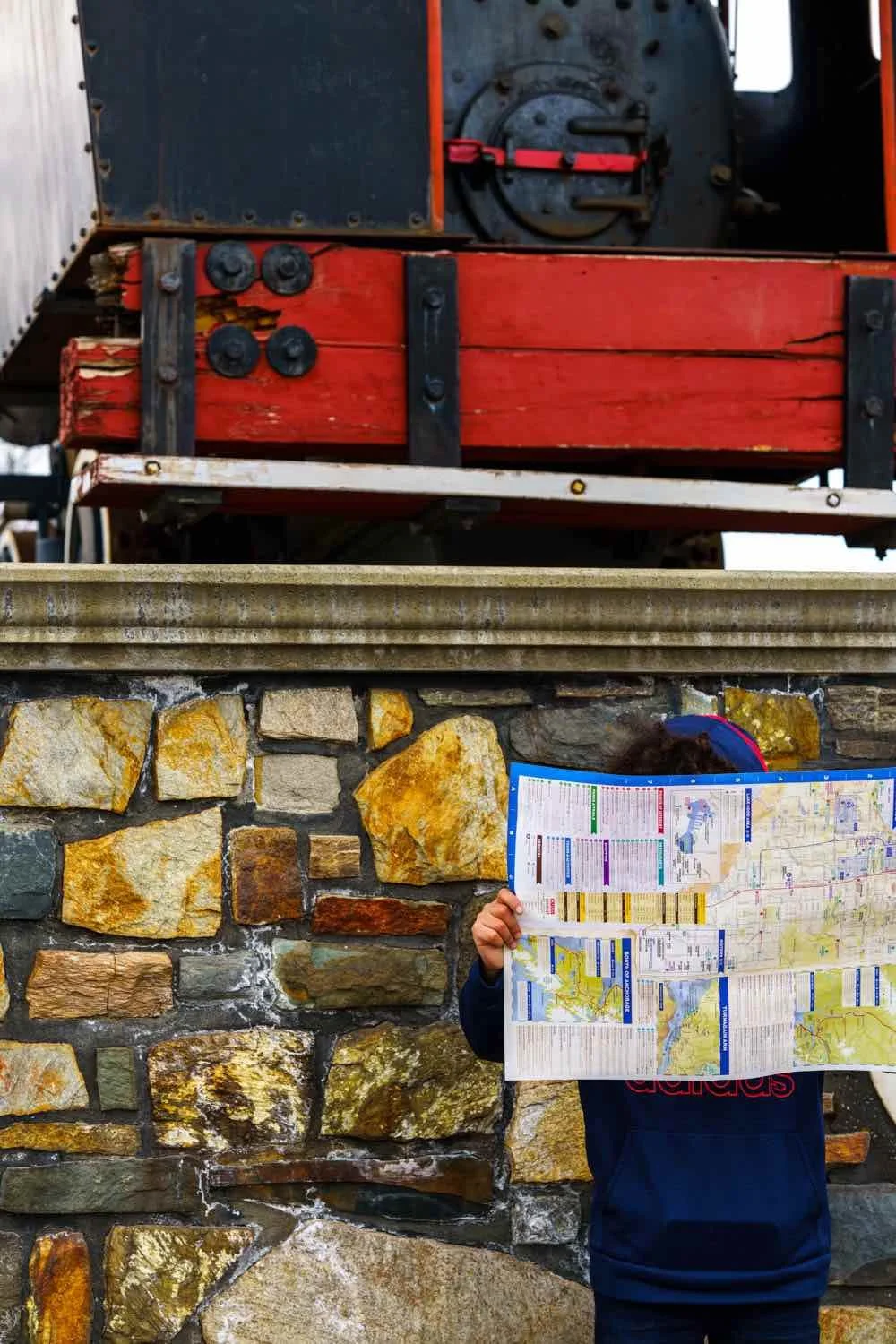 child reads map under display train.jpeg