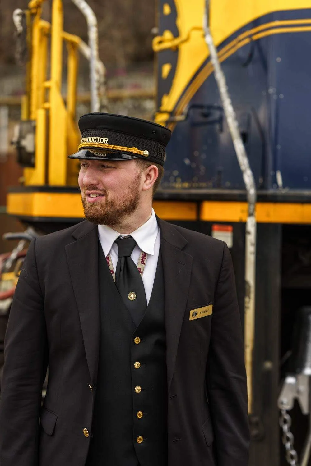 train conductor looks to right of the camera.jpeg