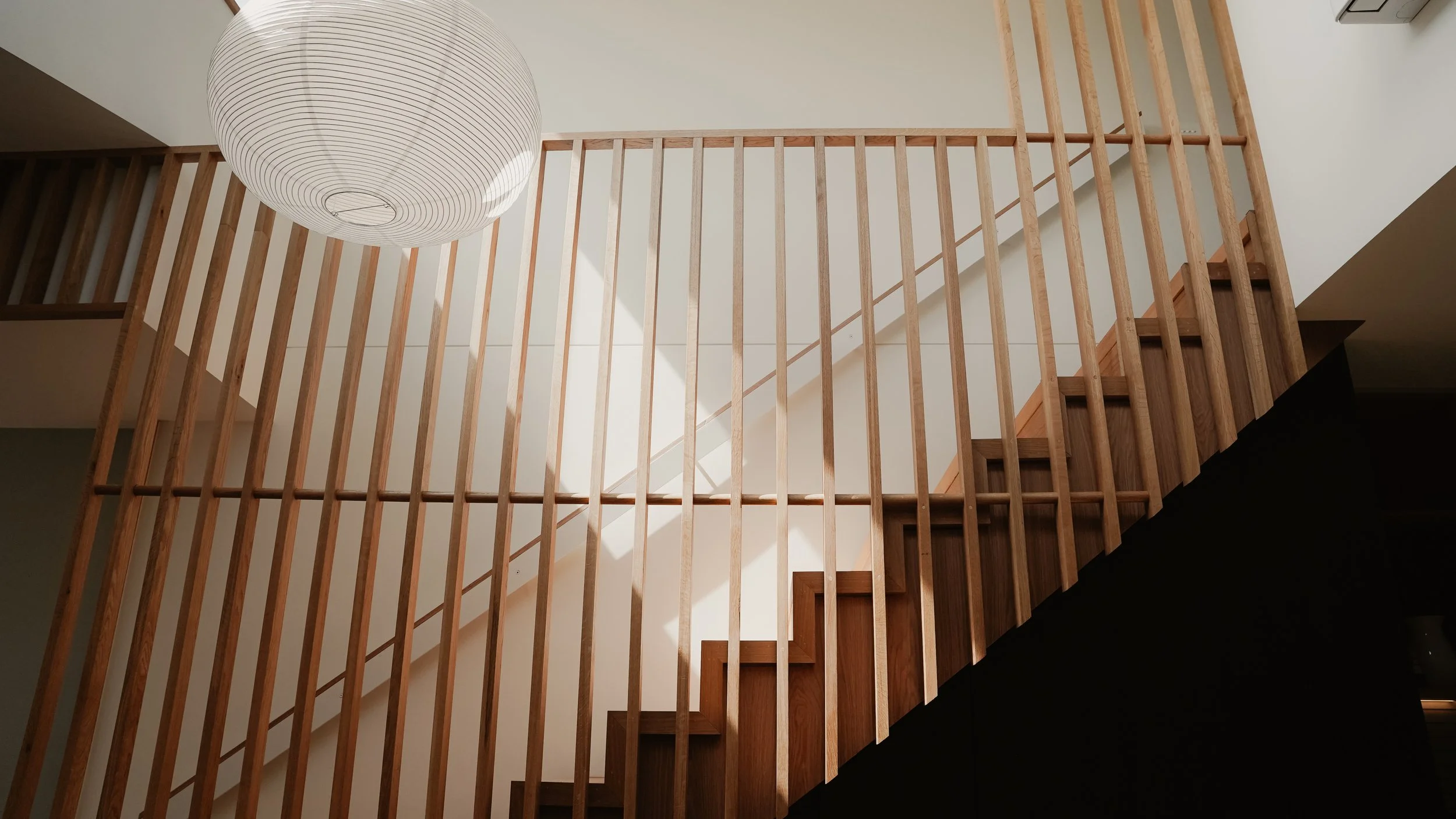 Oak timber screen and under stair study nook