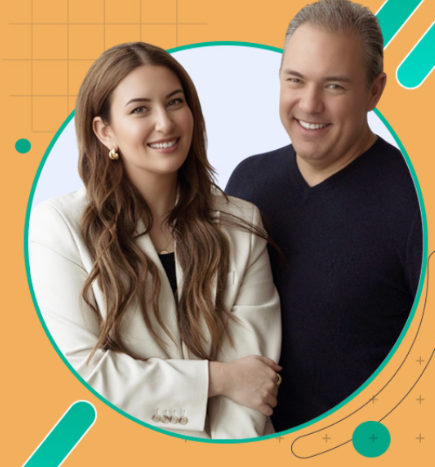 A man and woman smiling together in front of a colorful background