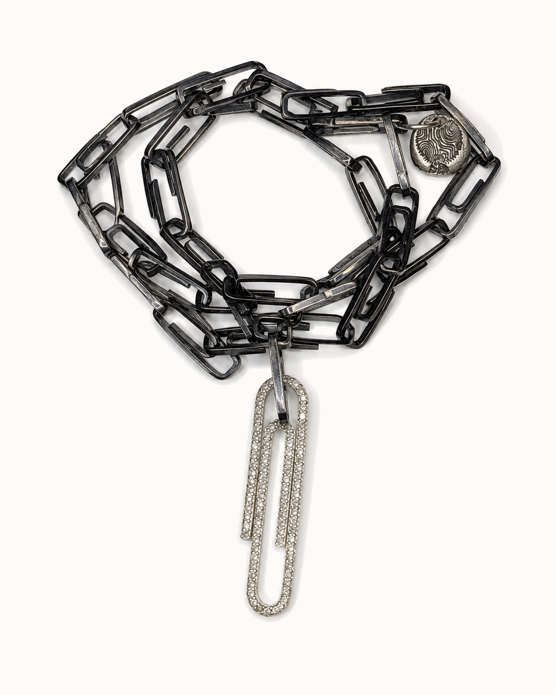.925 silver paperclip chain with a pavé paperclip pendant.