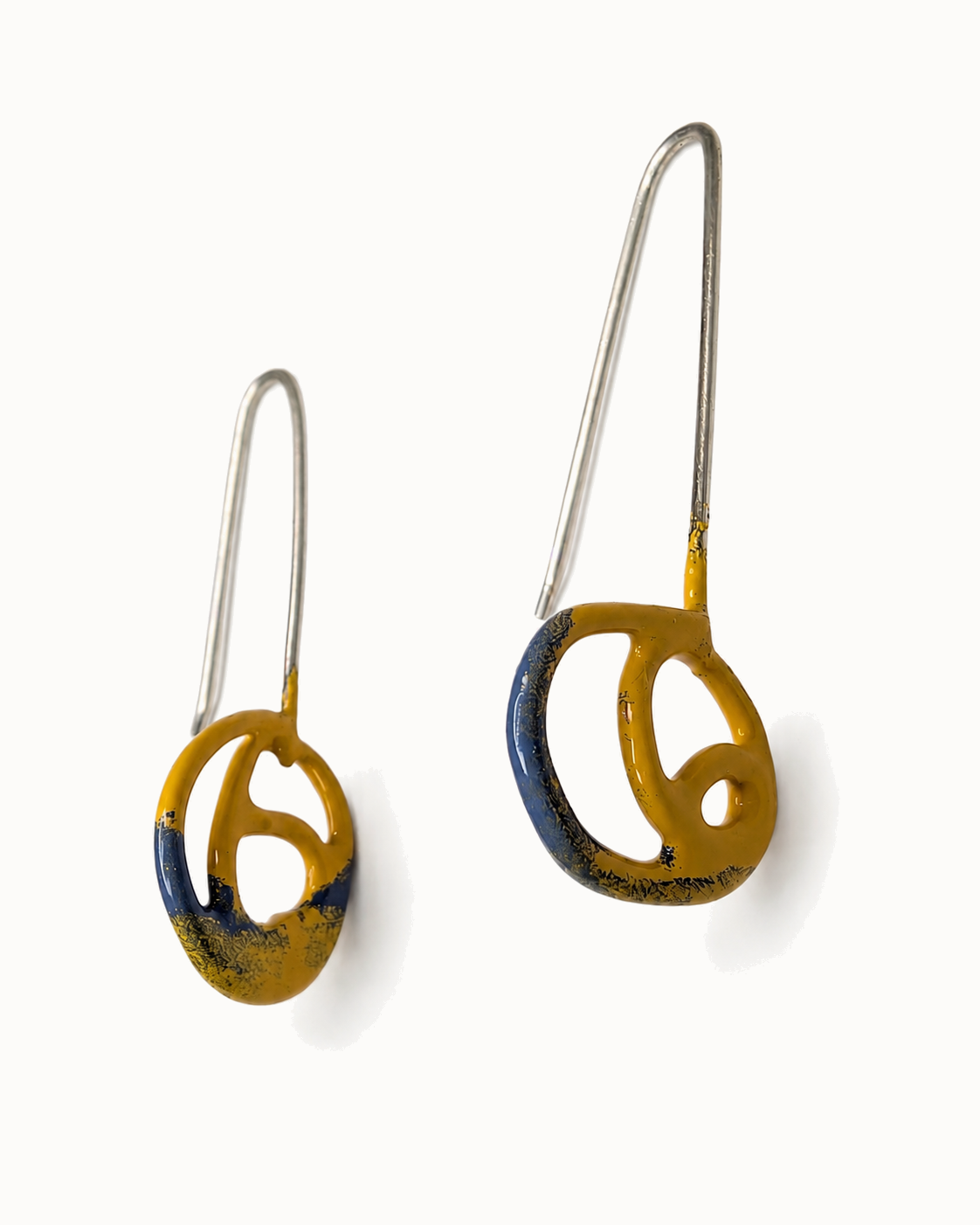 Hand sculptured enamel drops, mustard fading to denim blue.