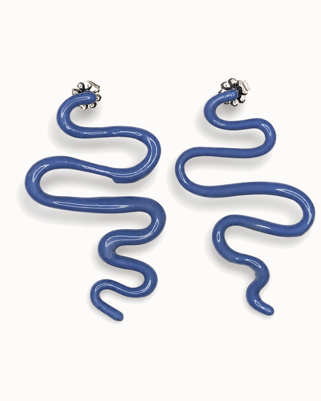 Long hand-bent sculpture drops in glossy denim-blue enamel.
