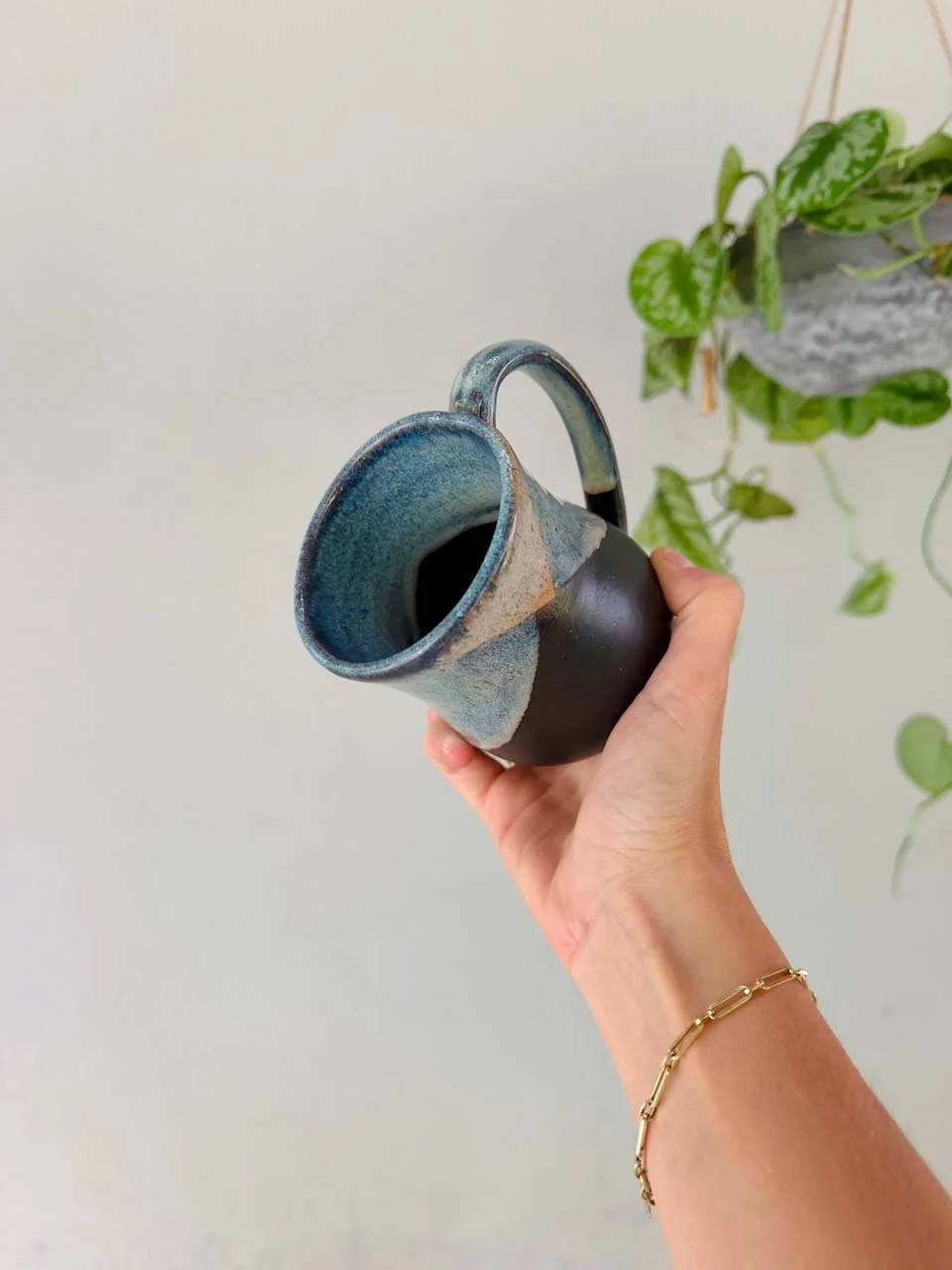wheel-thrown-stoneware-mug-black-glaze-speckled-clay.jpg