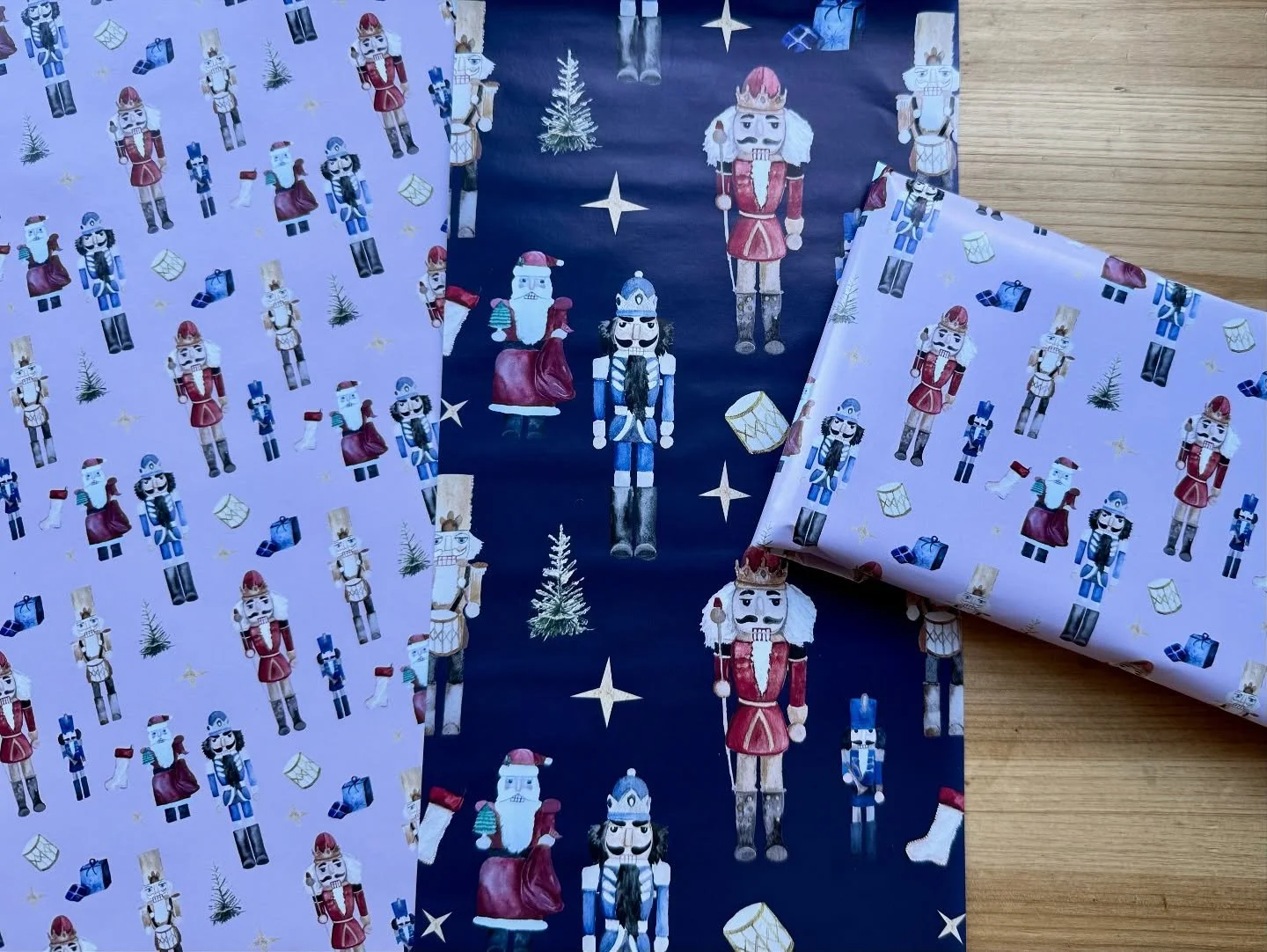 Running gift wrap proofs and I need opinions! (The dark blue was made large scale just to see details for proofing) *wrinkles are present only due to adjusted drying time*
I plan to make a second, winter themed design, but for this Nutcracker gift w