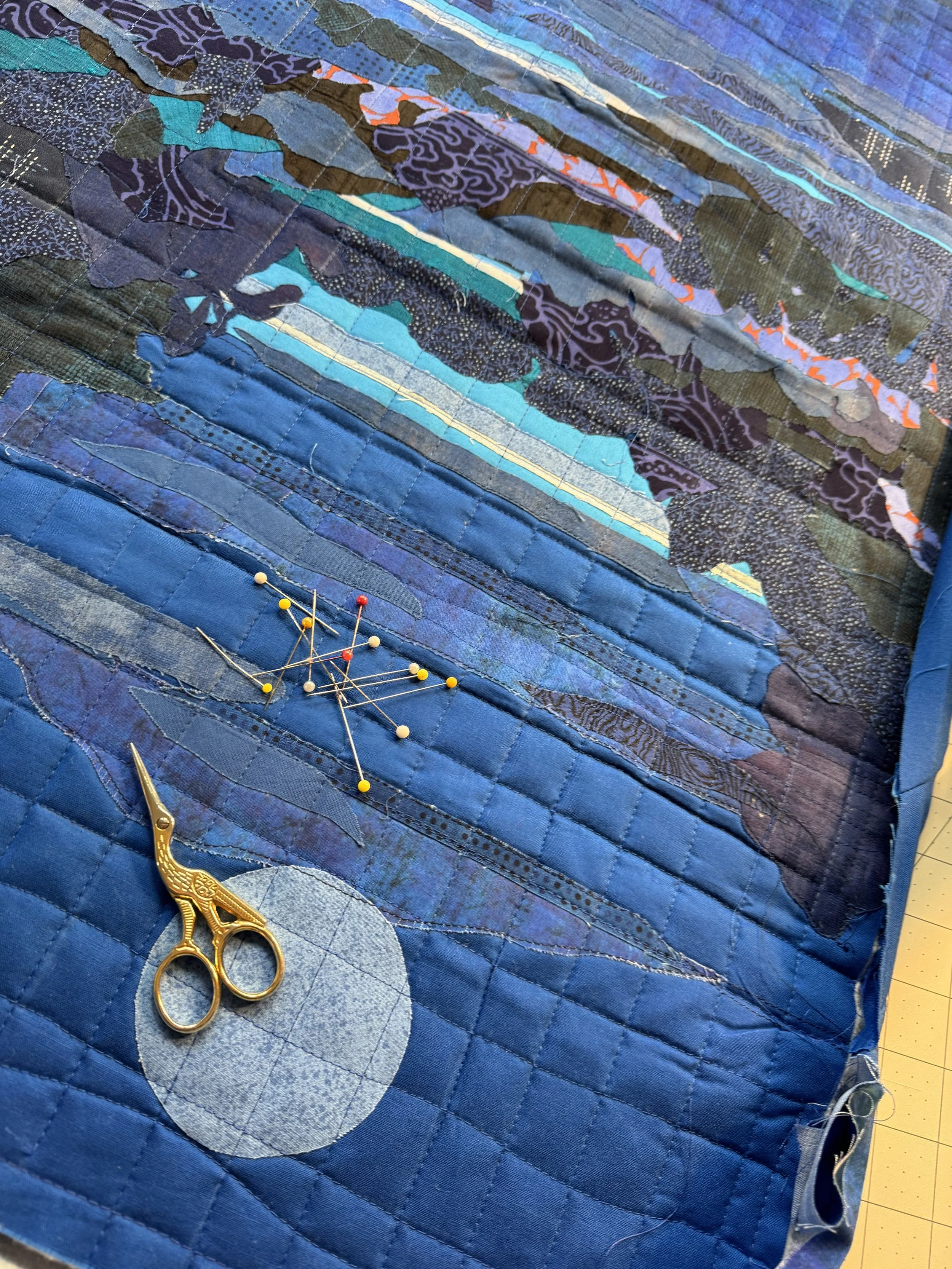 working on blue quilt.jpeg