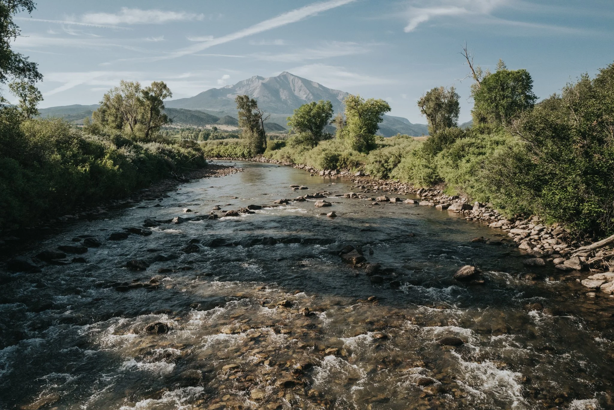 The Crystal River flows into Carbondale, Colorado with Mount Sopris in the background. Photo by Olivia Emmer.