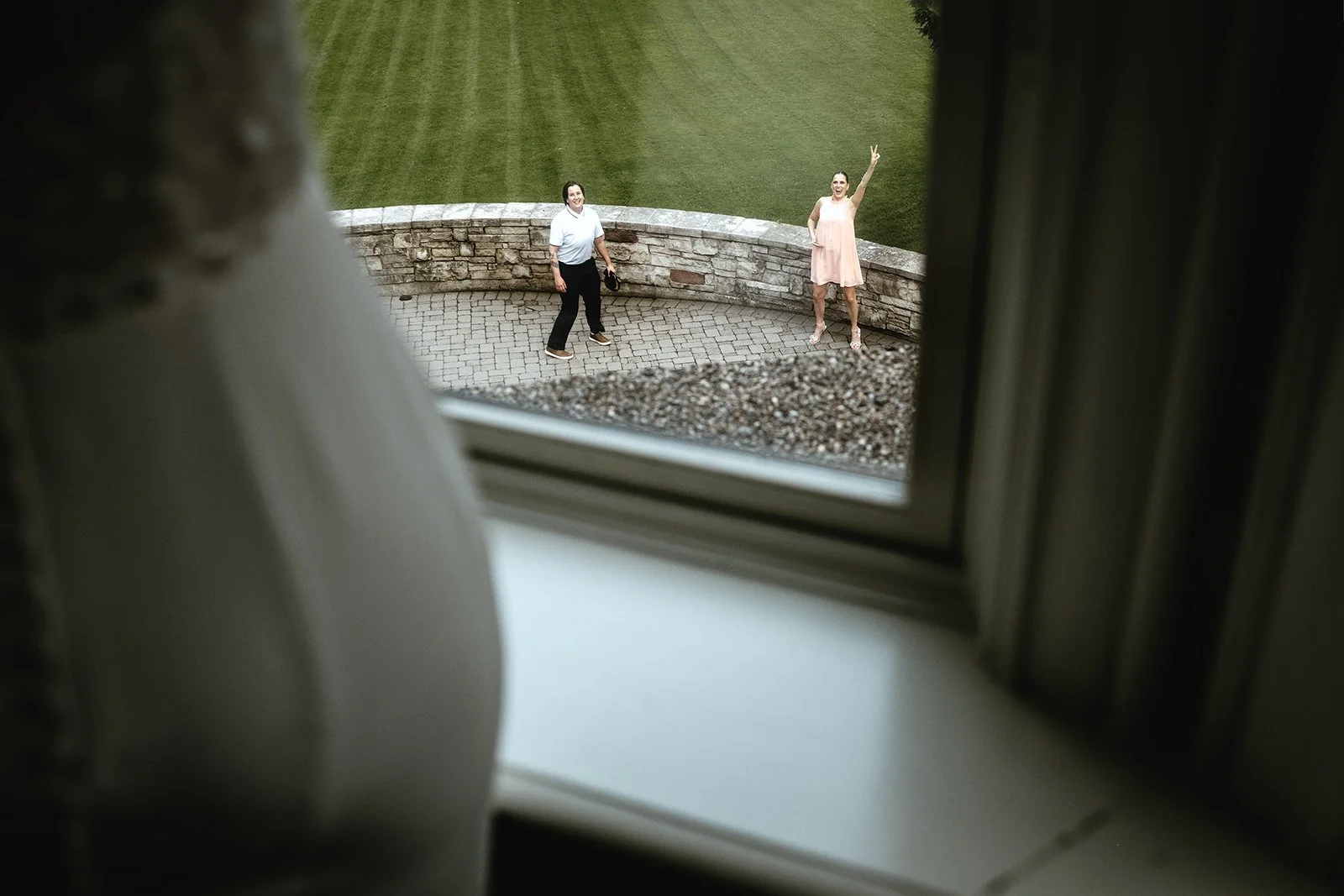 Documentary style wedding photography in Toronto of guests laughing