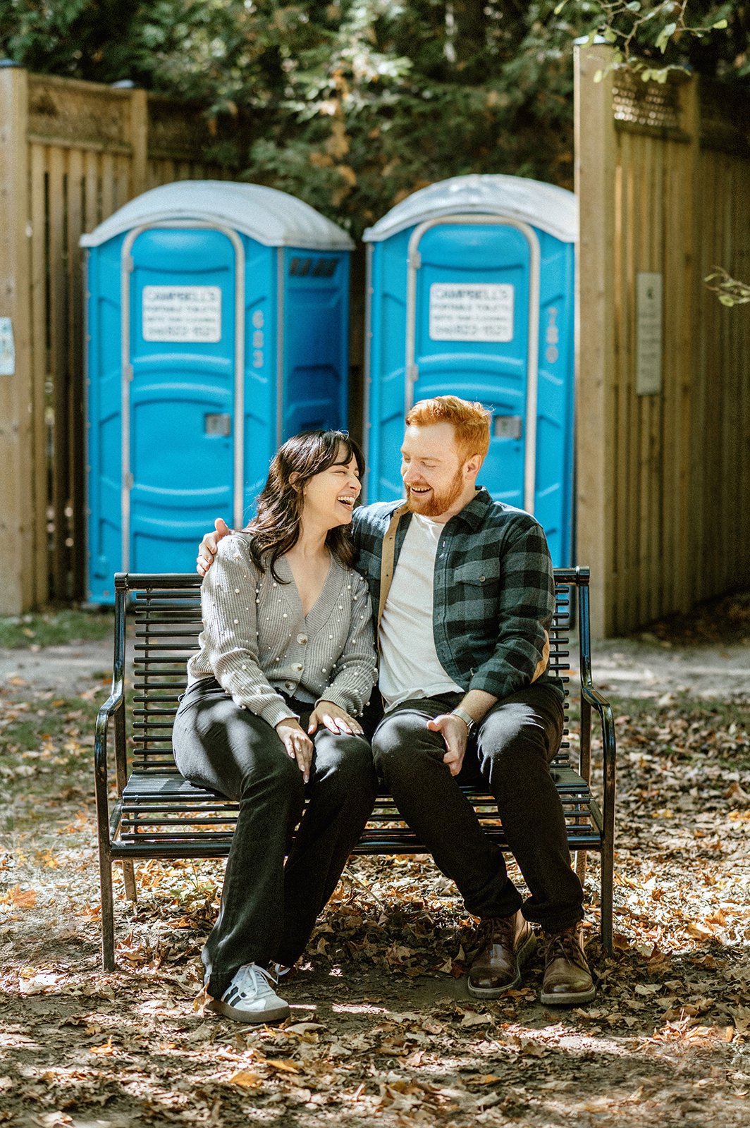 candid engagement photo of couple laughing during a non-traditional couple shoot in toronto