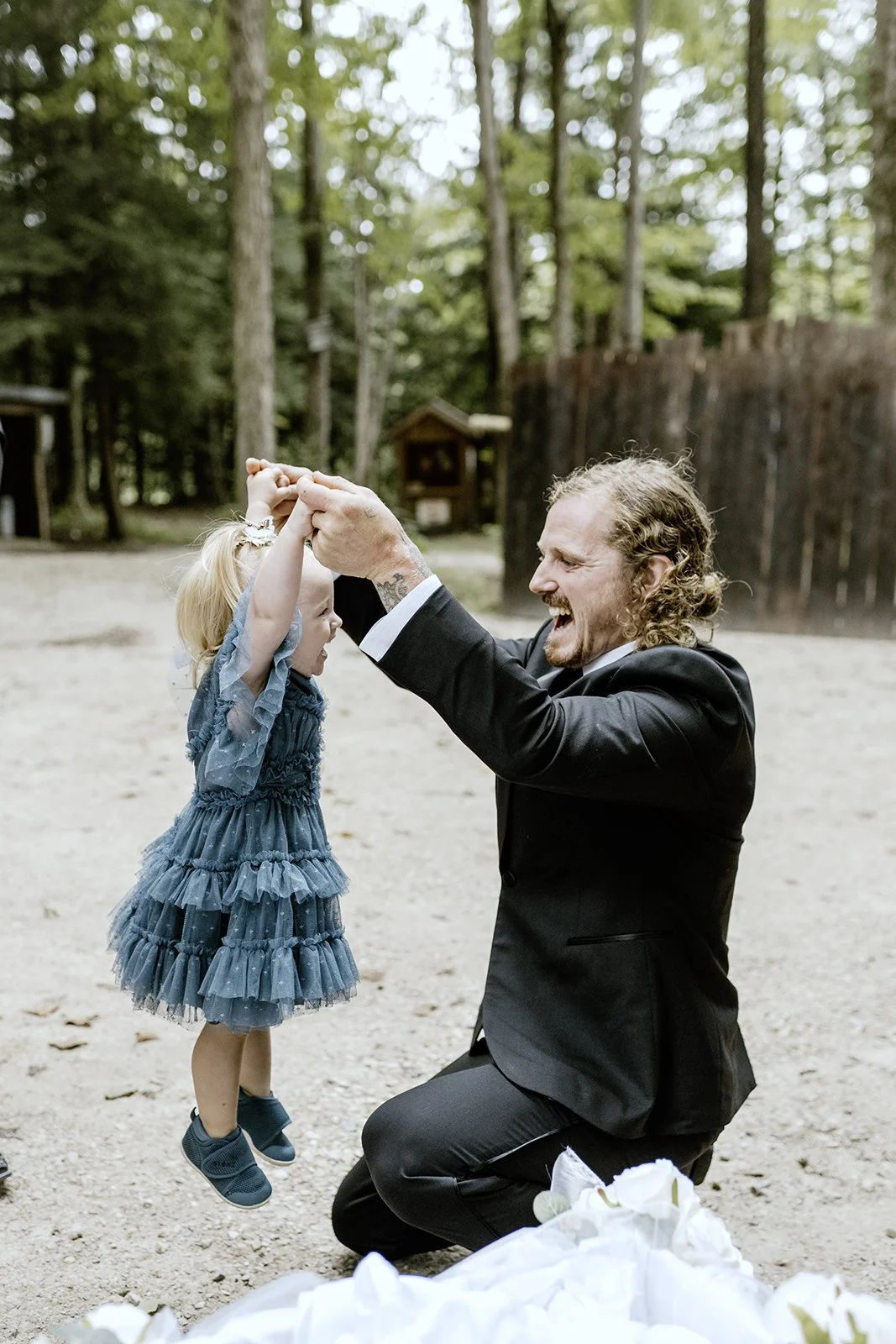 Guests of micro wedding in Toronto laughing with their children