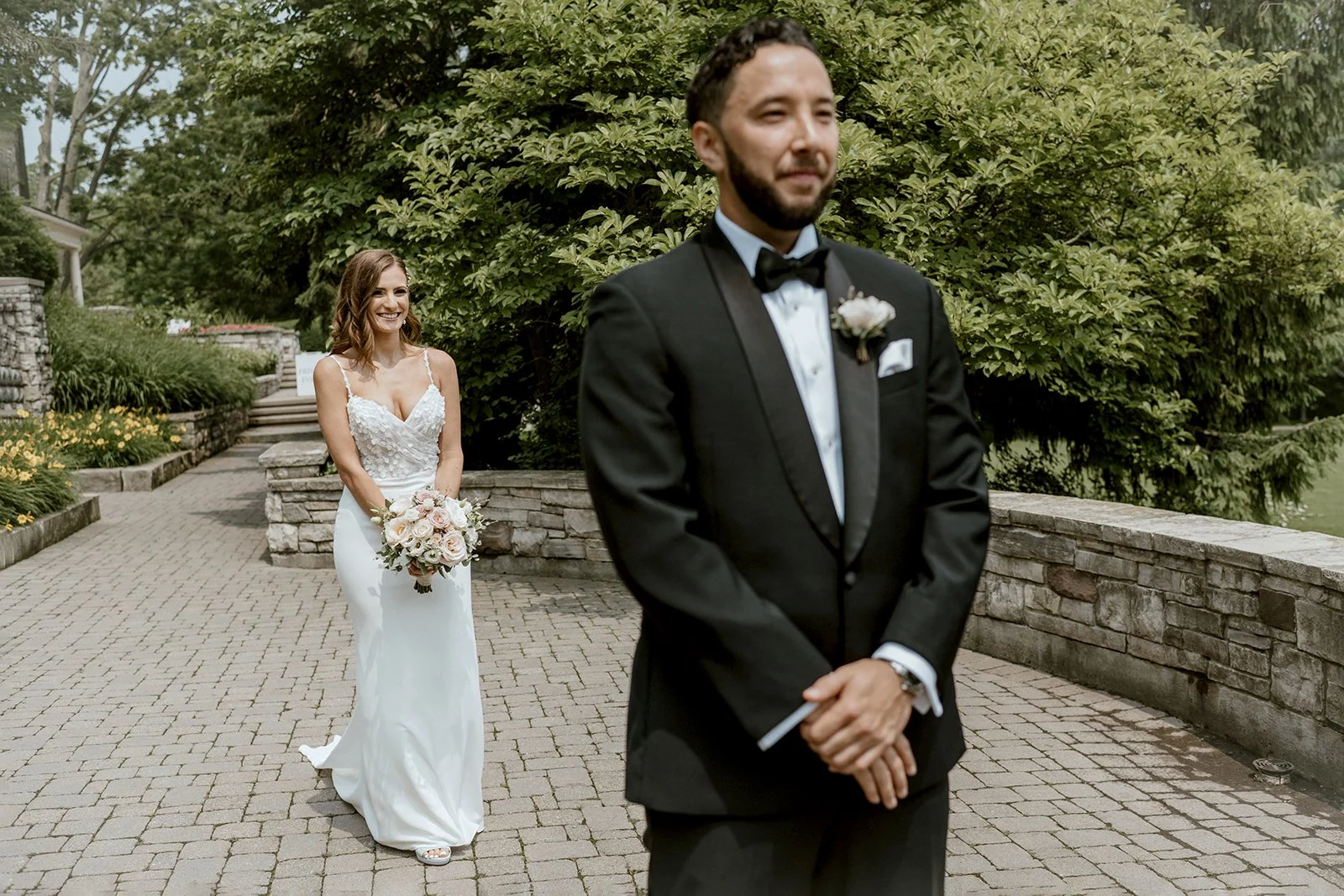 Bride about to reveal her wedding dress and first look photo with her groom on their wedding day in toronto