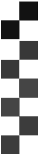 Stack of seven grey stones arranged vertically on a dark background.